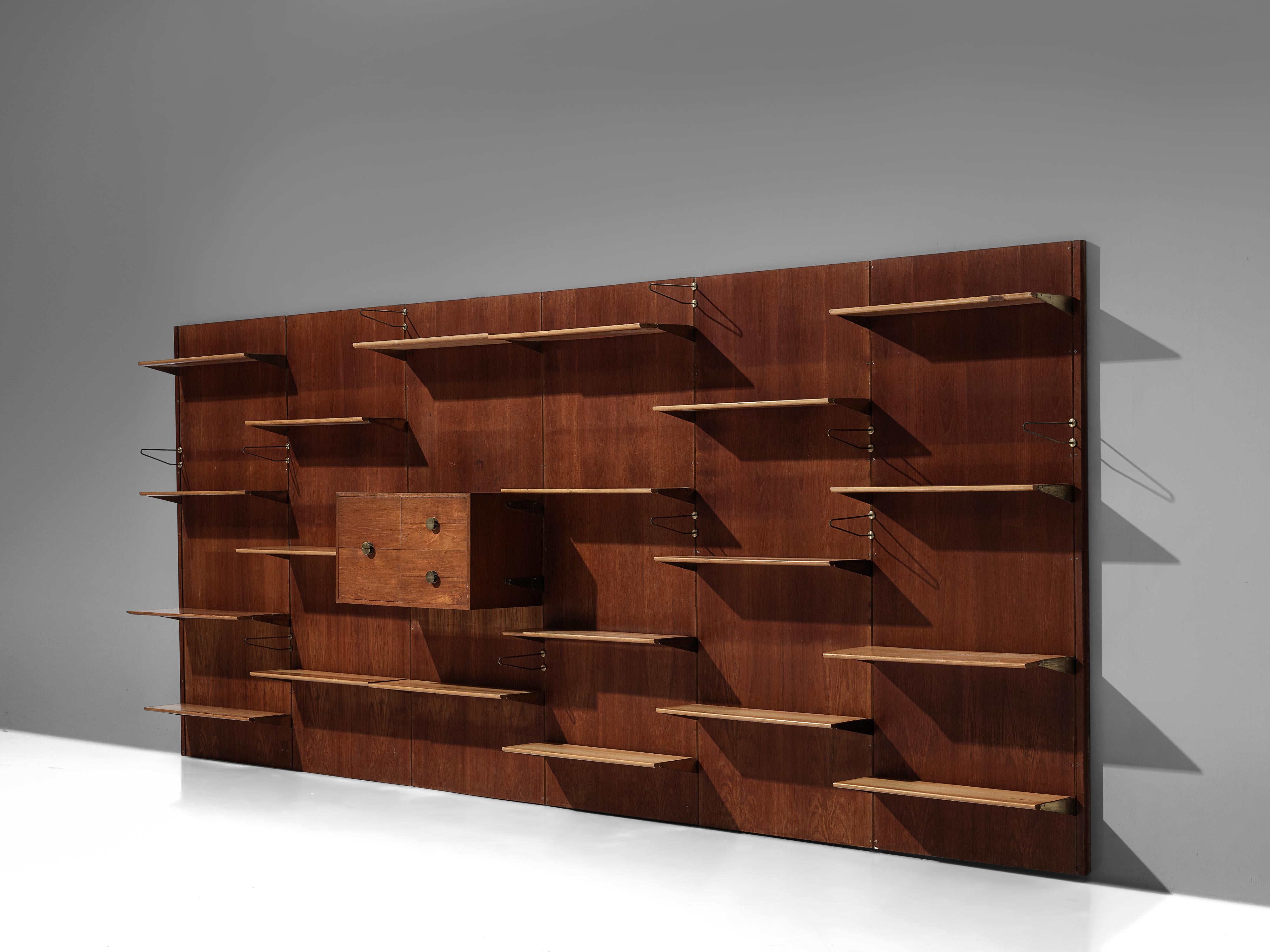 Finn Juhl for Bovirke, wall unit, model 'BO71', teak, pine, brass, Denmark, 1950s 

This eccentric library unit designed by the renowned designer Finn Juhl is based on an elongated construction, offering a variety of different storage possibilities.