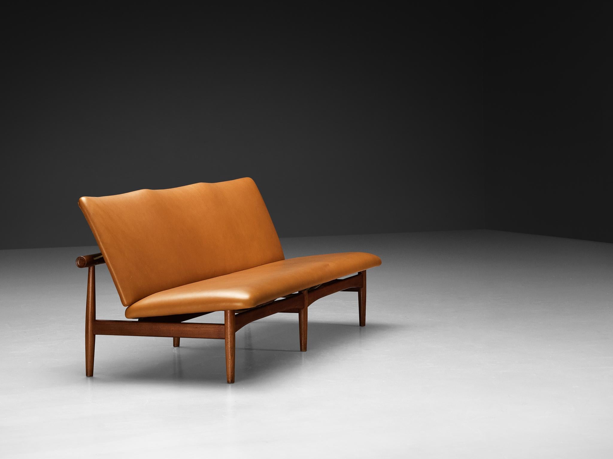 Finn Juhl for France & Søn, 'Japan' sofa, model ‘137/3’, teak, brass, reupholstered in leather 