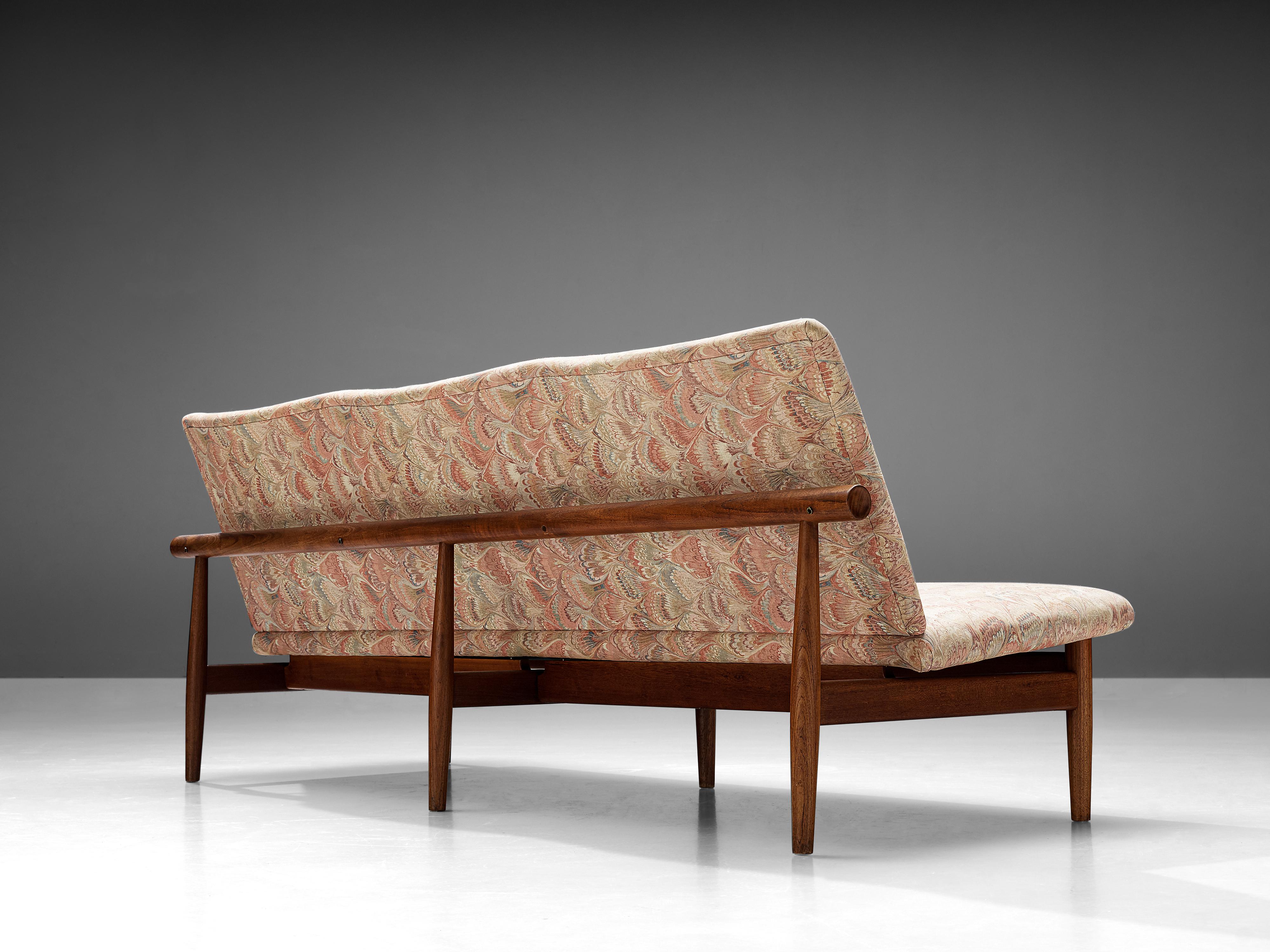 Finn Juhl for France & Søn, sofa model ‘137/3’, teak, brass, upholstery, Denmark, designed in 1957

This sofa from the ‘Japan’ series that Finn Juhl designed for France & Søn exemplifies Juhl’s idea to detach carrying from carried elements. The seat
