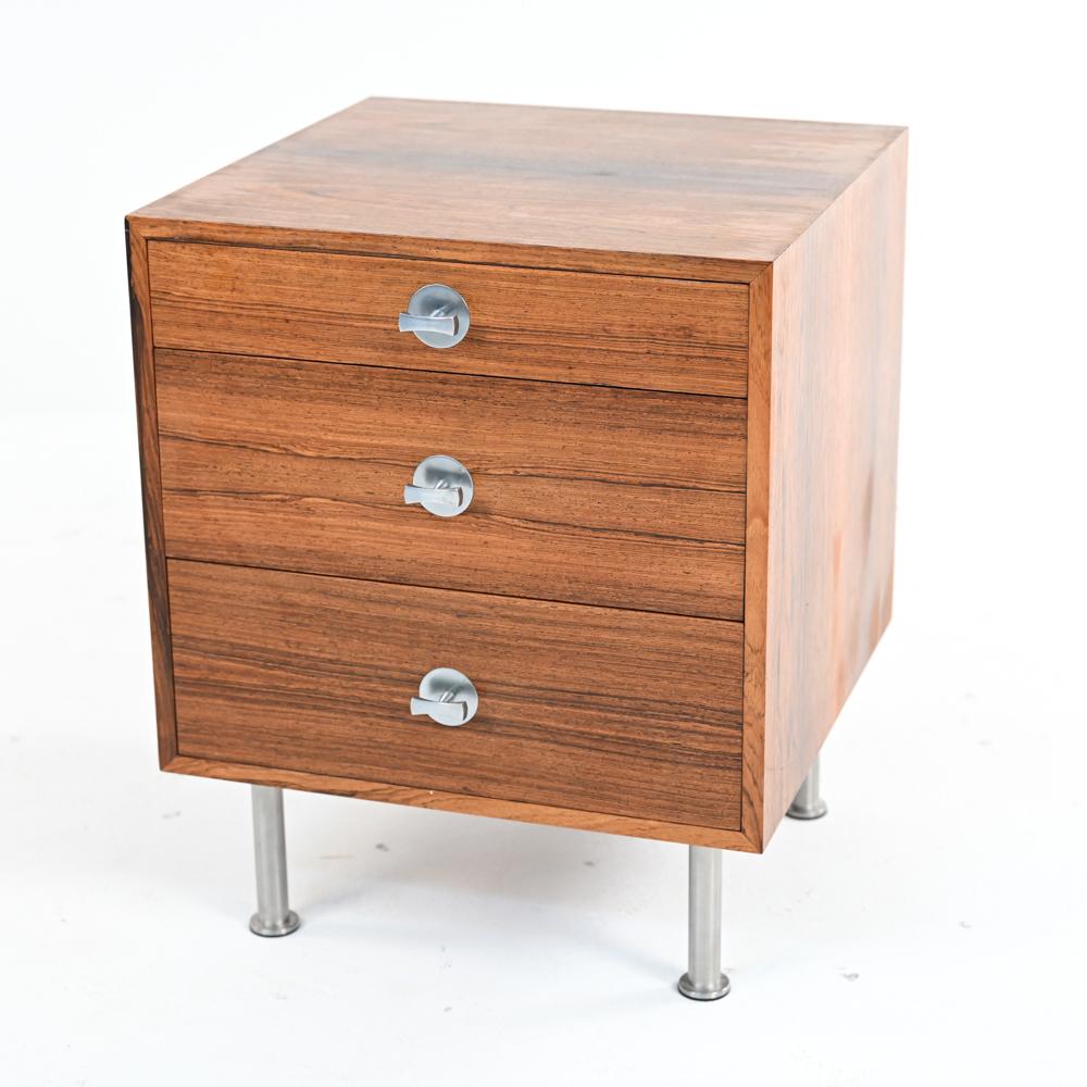 A stunning nightstand or end table in petite three-drawer chest form, designed by Finn Juhl for France & Son as part of the 