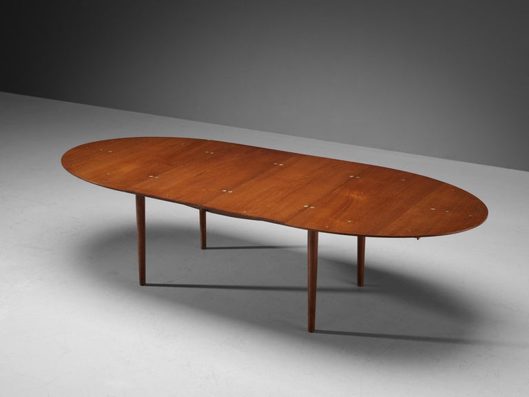 Finn Juhl for Niels Vodder, dining table model ‘Judas’ FJ49, teak, silver, Denmark, designed in 1948

With the creation of this exquisite oval shaped dining room table, Finn Juhl focused on combining functionality with an aesthetically pleasing