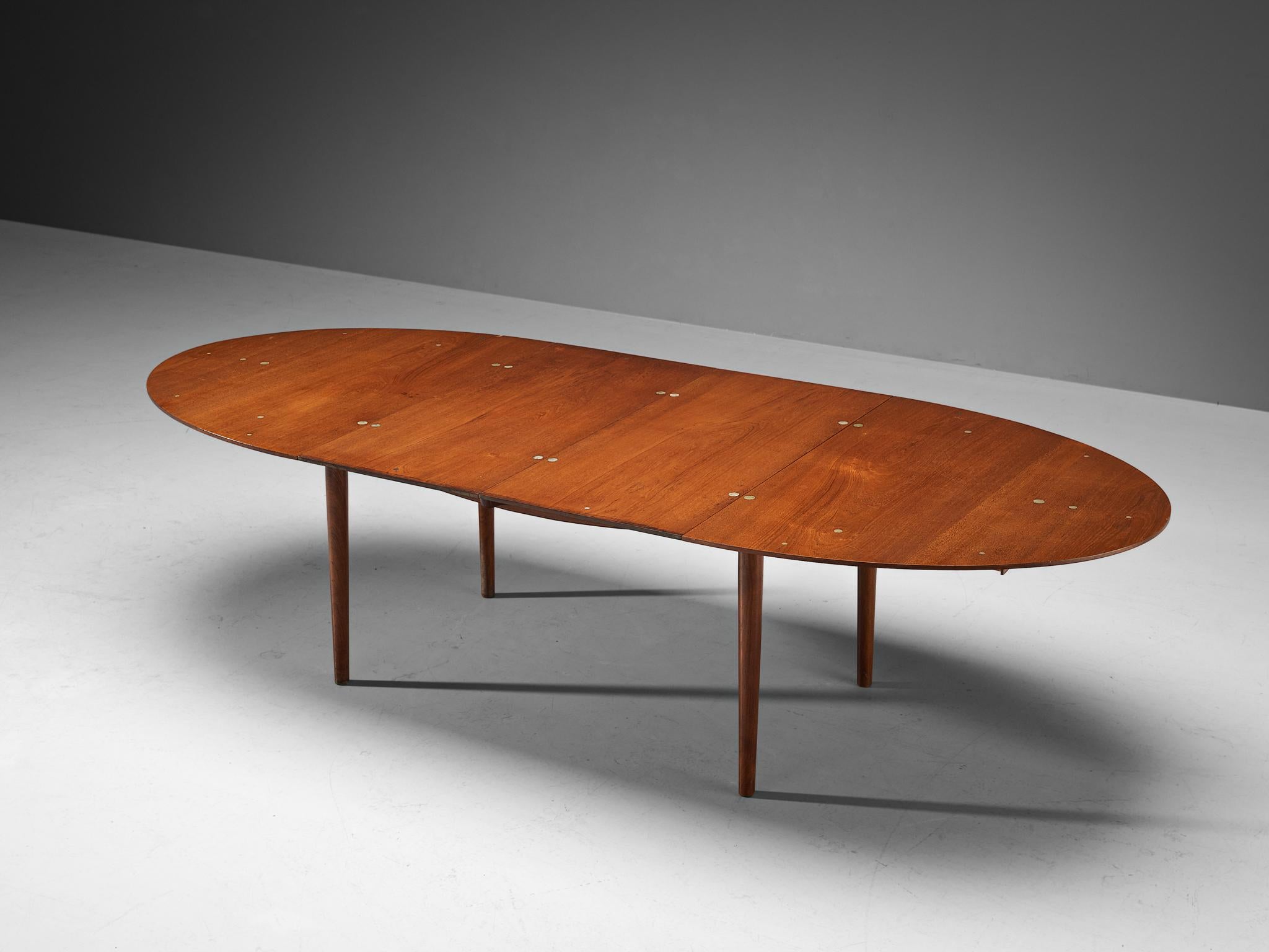 Finn Juhl for Niels Vodder, dining table model ‘Judas’ FJ49, teak, silver, Denmark, designed in 1948

With the creation of this exquisite oval shaped dining room table, Finn Juhl focused on combining functionality with an aesthetically pleasing
