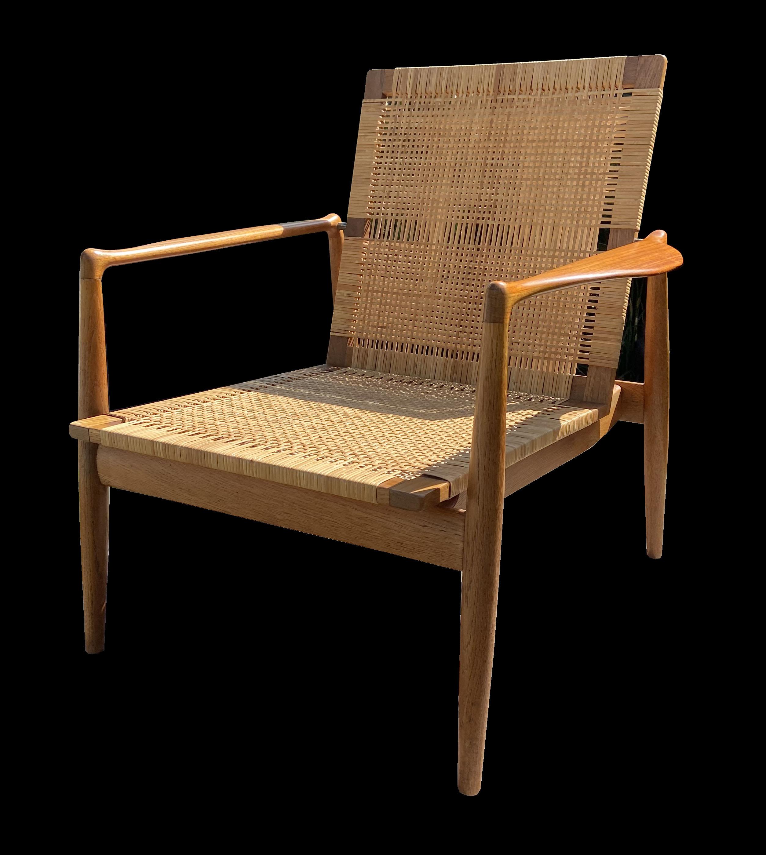 This is a really beautiful original example of this scarce lounge chair, designd by Finn Juhl and produced by Soren Willadsen. The frame of the chair is Oak, the arms are Teak and the seat and back Cane.