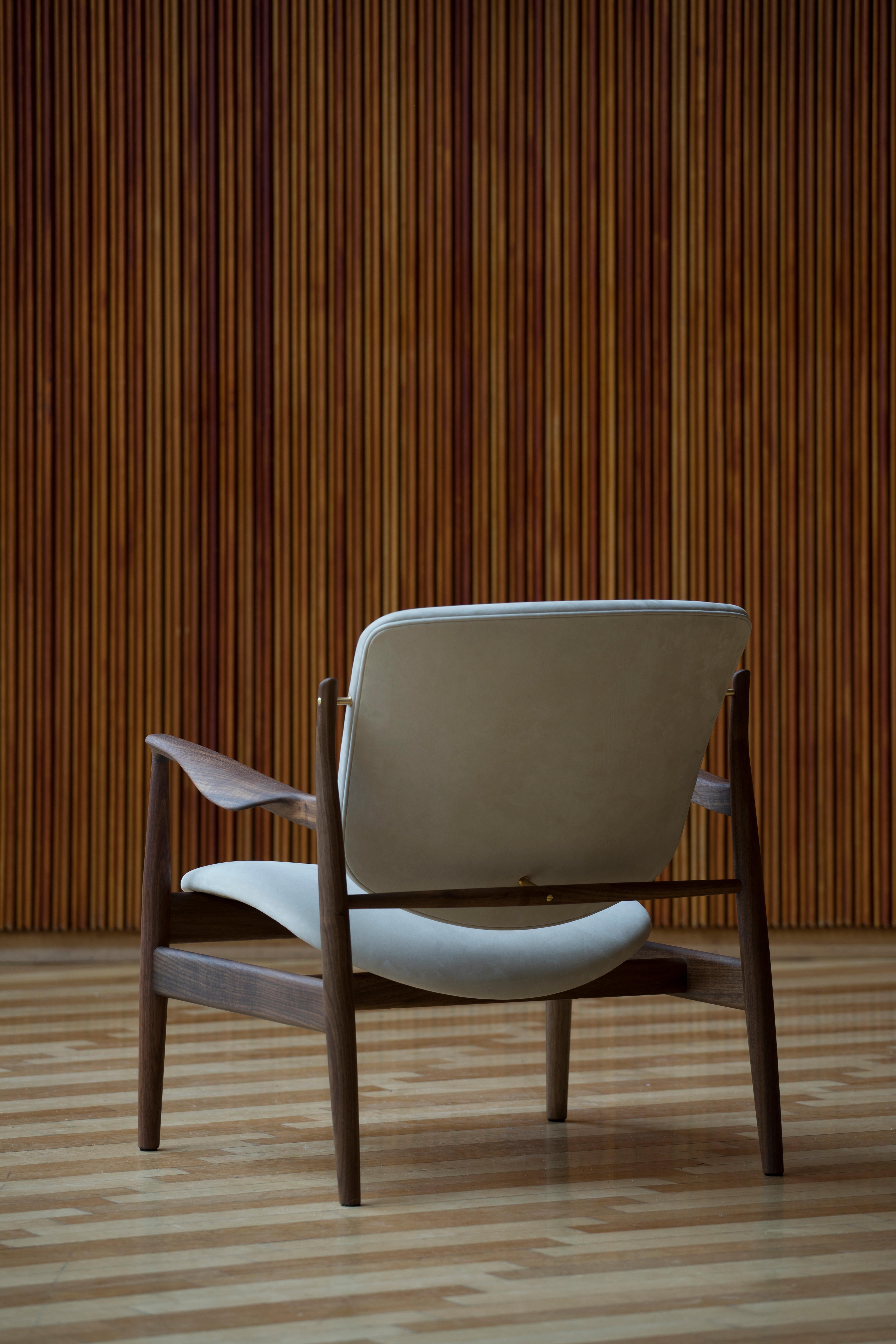 Armchair designed by Finn Juhl in 1956, relaunched in 20016.
Manufactured by House of Finn Juhl in Denmark.

Finn Juhl rode a wave of international success during the 1950s - in part thanks to his partnership with the Danish furniture manufacturer