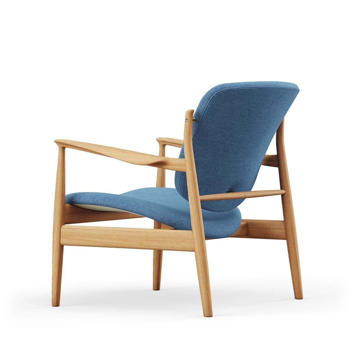 Armchair designed by Finn Juhl in 1956, relaunched in 20016.
Manufactured by House of Finn Juhl in Denmark.

Finn Juhl rode a wave of international success during the 1950s - in part thanks to his partnership with the Danish furniture manufacturer