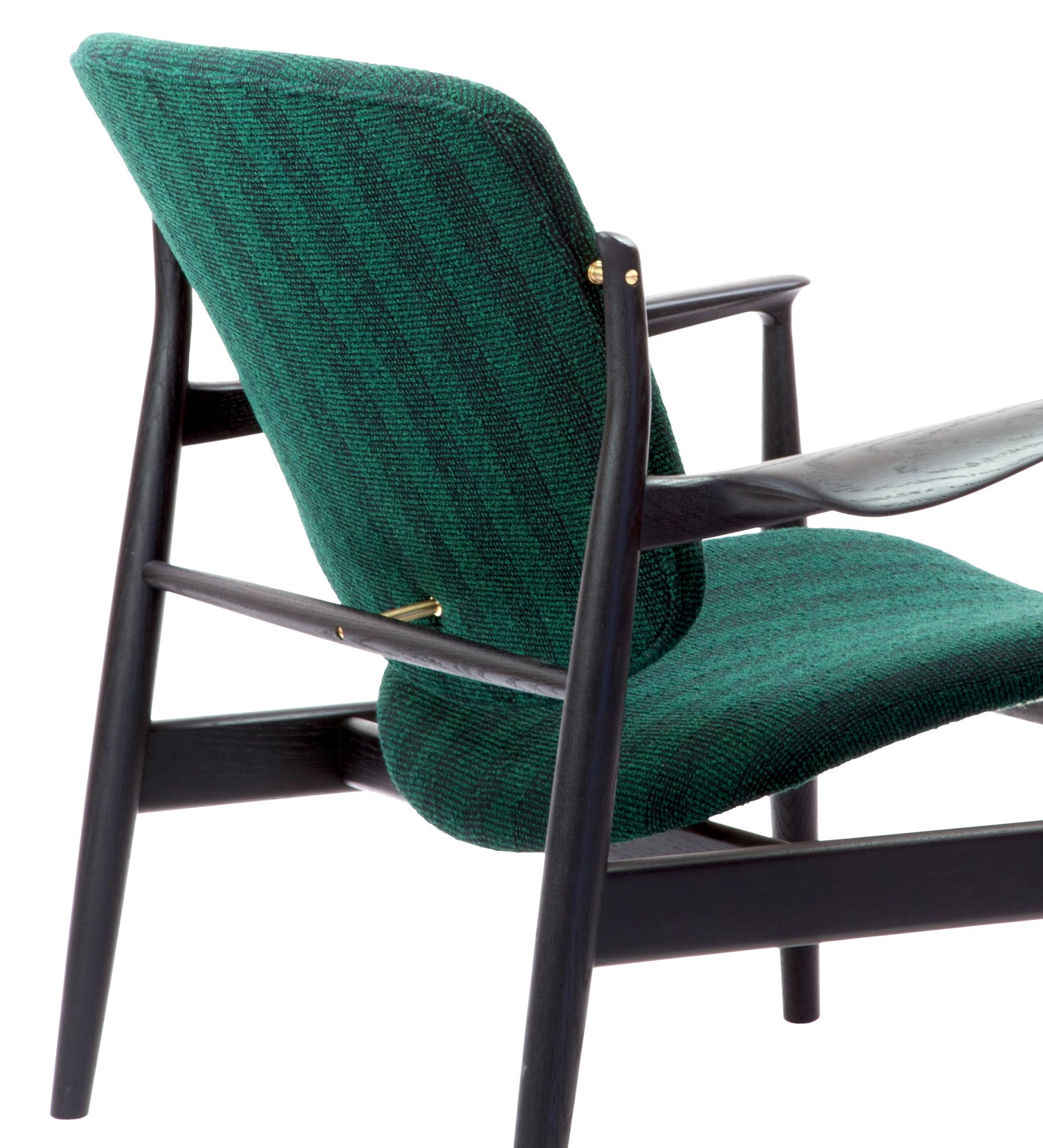 Armchair designed by Finn Juhl in 1956, relaunched in 20016.
Manufactured by House of Finn Juhl in Denmark.

Finn Juhl rode a wave of international success during the 1950s - in part thanks to his partnership with the Danish furniture