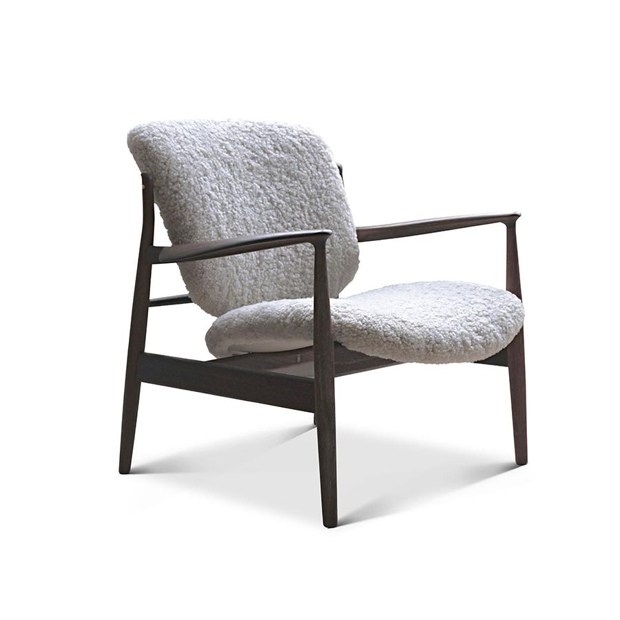 Armchair designed by Finn Juhl in 1956, relaunched in 20016.
Manufactured by House of Finn Juhl in Denmark.

Finn Juhl rode a wave of international success during the 1950s - in part thanks to his partnership with the Danish furniture manufacturer