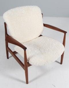 Finn Juhl France lounge chair in sheepskin, walnut