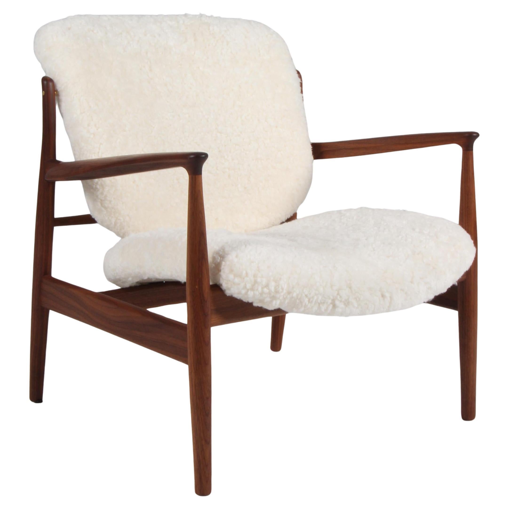 Finn Juhl France lounge chair in sheepskin, walnut For Sale