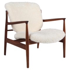 Finn Juhl France lounge chair in sheepskin, walnut