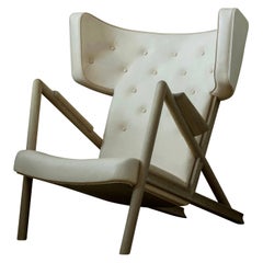 Poltrona "Grasshopper" di Finn Juhl in legno di rovere e pelle