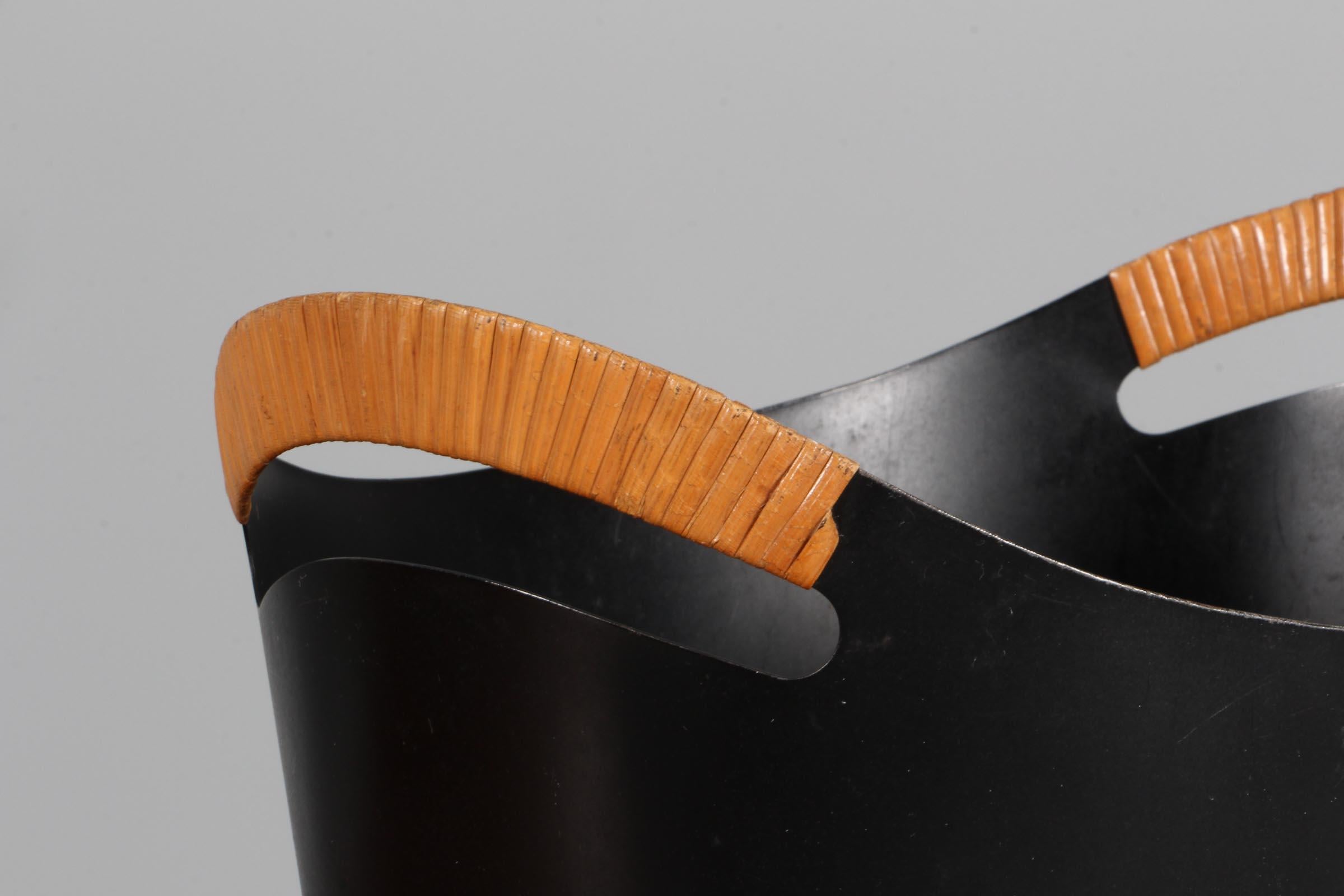 Finn Juhl & Grethe Kornerup-Bang paperbin in laquered steel.

Handles with cane.