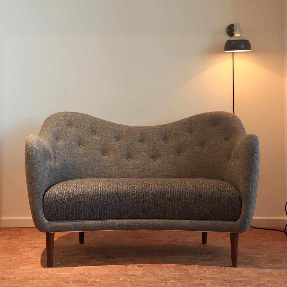 Sofa designed by Finn Juhl in 1946, relaunched in 2008.
Manufactured by House of Finn Juhl in Denmark.

The current fabric of the images is out of stock, it will be upholstered with a similar fabric but it might look a bit different,

As the