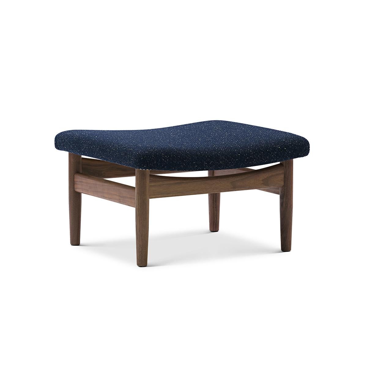 Stool designed by Finn Juhl in 1957, relaunched in 2007.
Manufactured by House of Finn Juhl in Denmark.

Finn Juhl designed footrests for a few of his iconic furniture pieces, including the Japan Series. 

The Japan footstool with its organic shaped