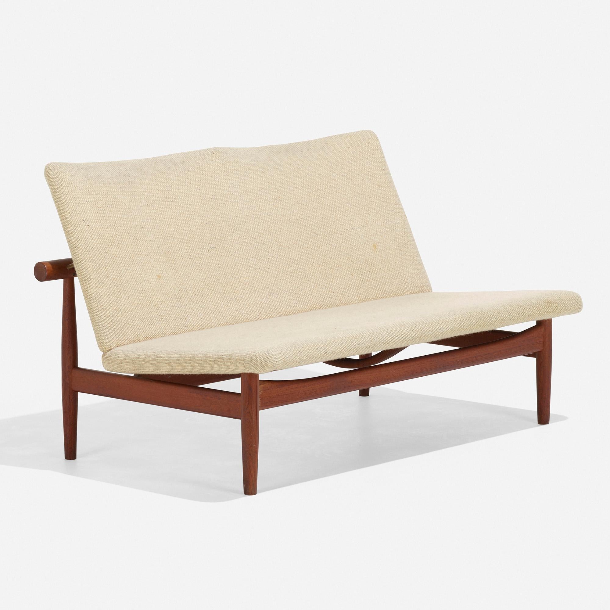 Made by: France & Søn, Denmark, 1953

Material: teak, upholstery, brass

Size: 50 w × 27.5 d × 28 h inches

Description: Metal manufacturer's label to back stretcher ‘Fd Charles France 6335539’. Metal distributor's label to back stretcher