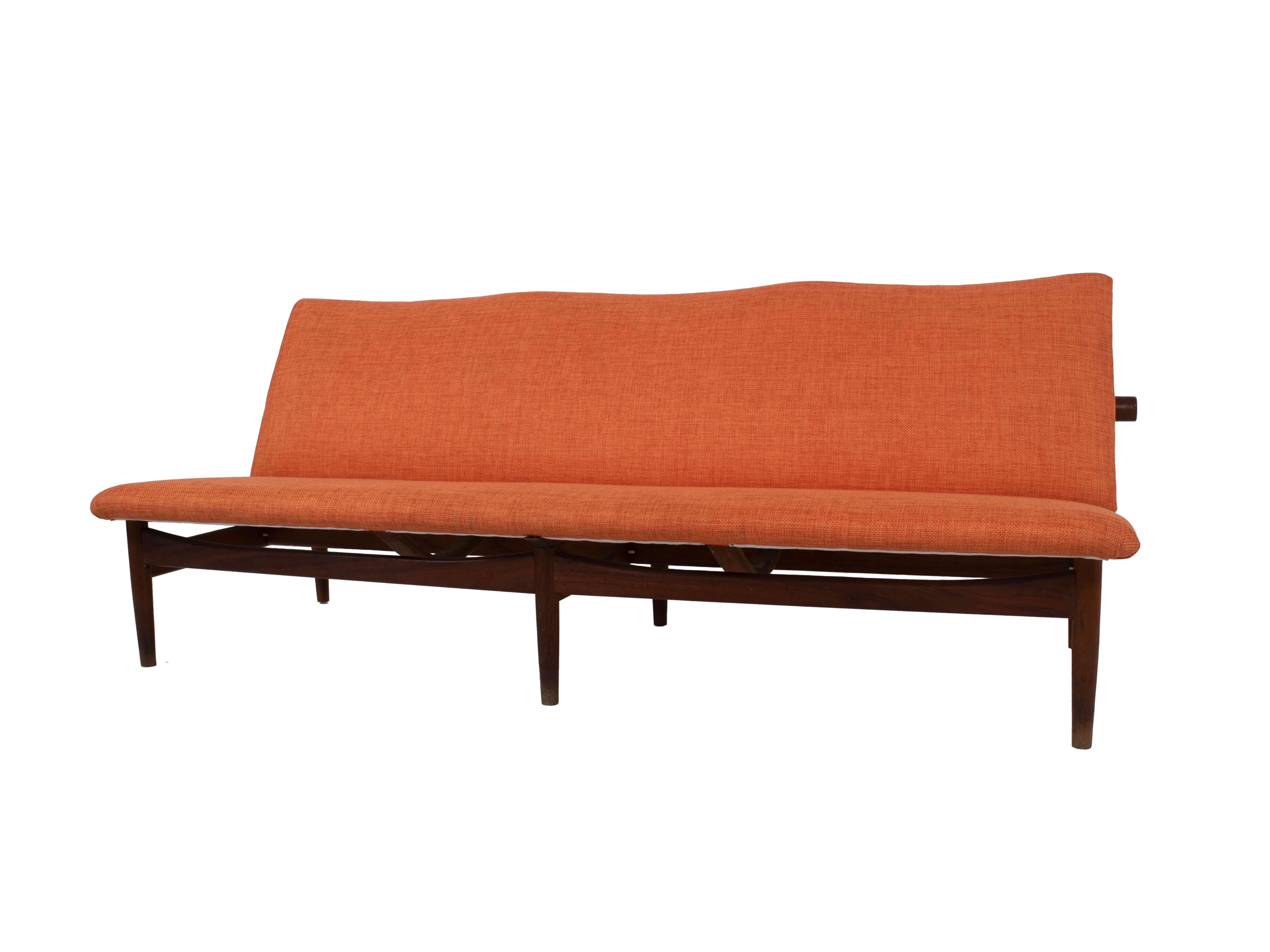 Amazing Finn Juhl sofa Model 137 in teak for France & Son, Denmark 1950s. This three-seater 'Japan' sofa has the elegance and round shapes that are so recognizable for Finn Juhl and the Scandinavian Modern Design. The sofa is wonderfully upholstered