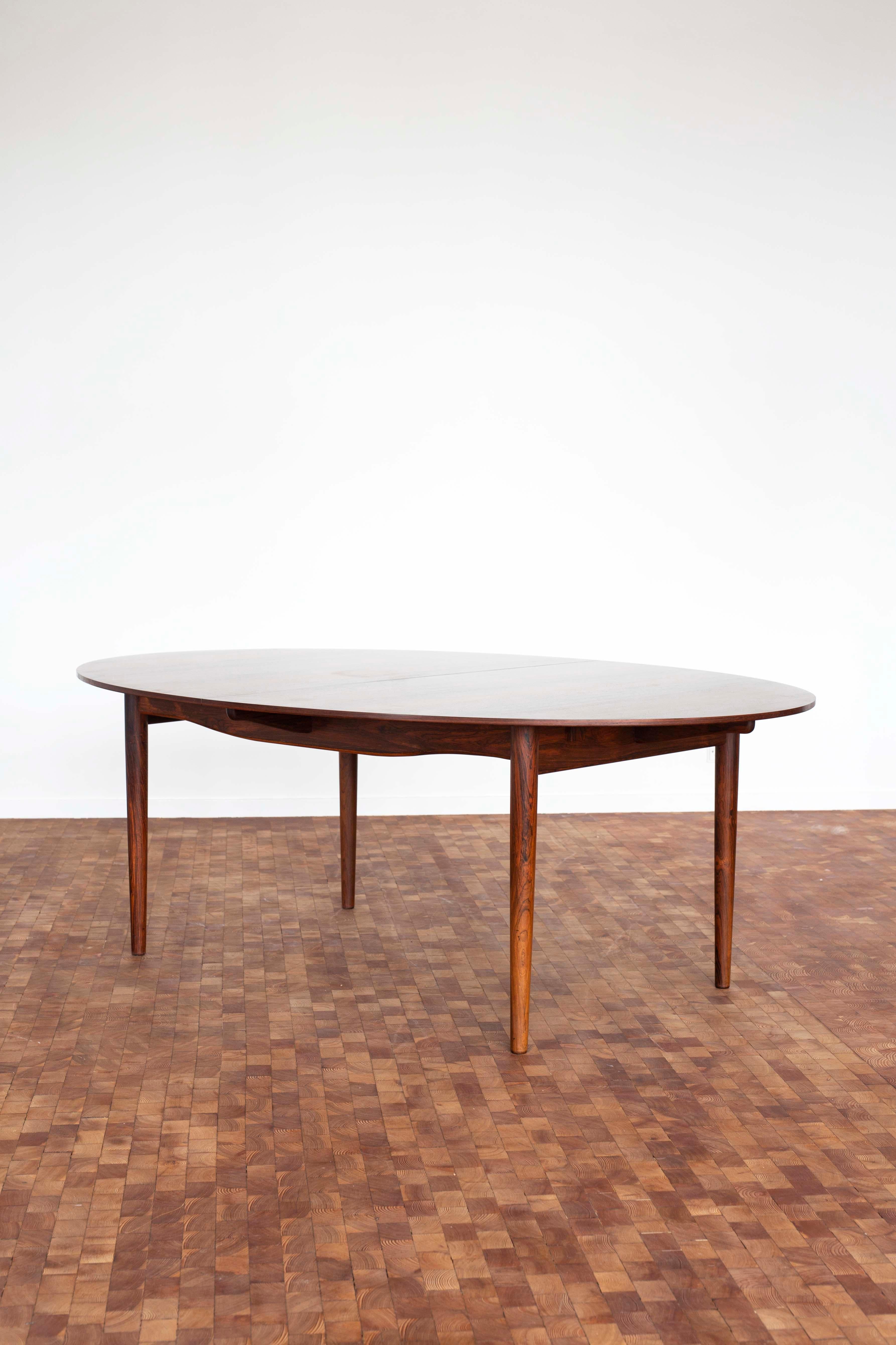 Rare Finn Juhl 'Judas' table in Brazilian rosewood. Including two extension leaves in very fine original condition. This is the version without silver coin inlays. 

Only one owner since purchased in Copenhagen, 1952. 

Designed 1948 and
