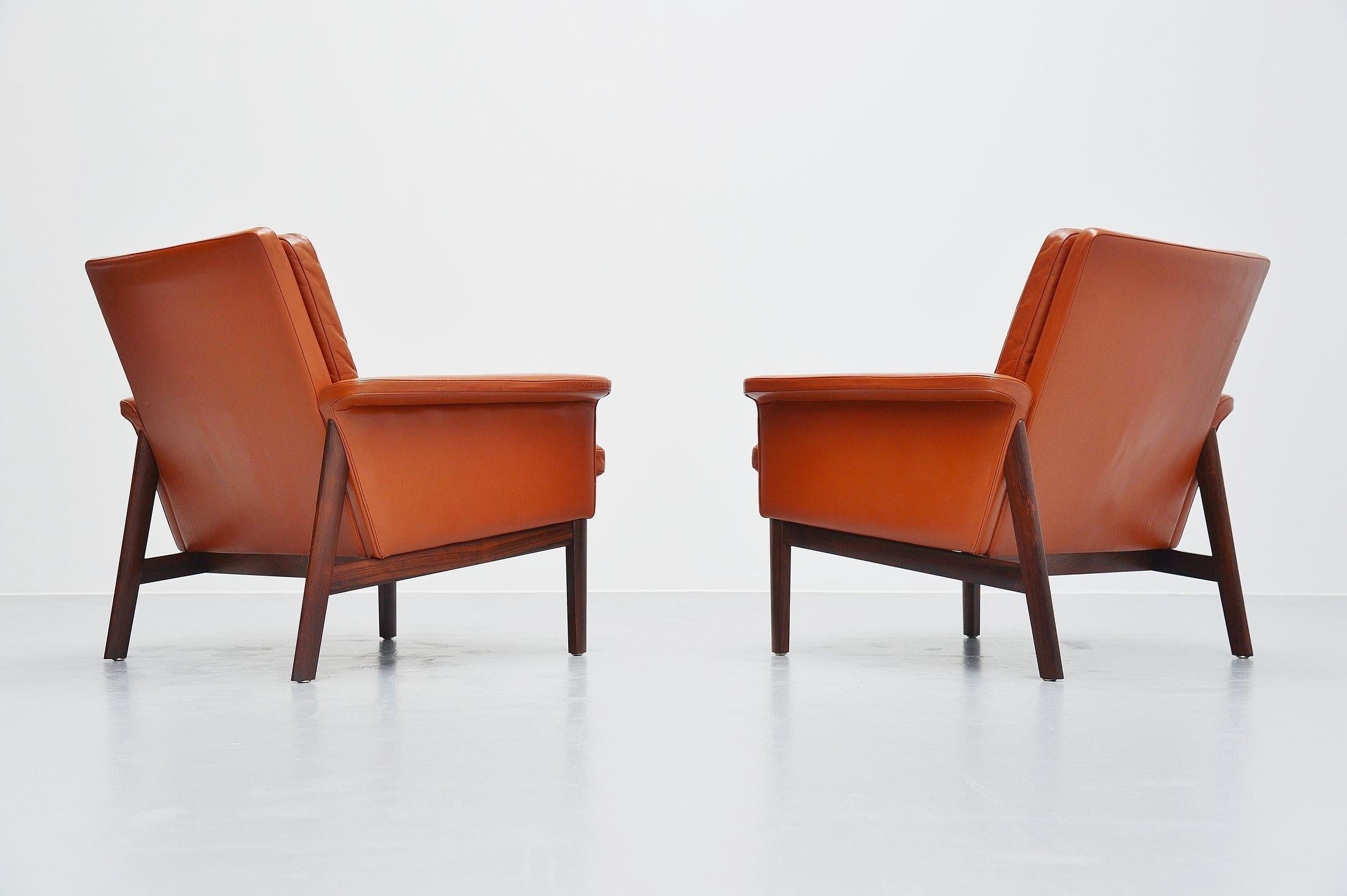 Subtle modern so called Jupiter lounge chairs model 218 designed by Finn Juhl and manufactured by France and Son, Denmark 1965. This set of chairs has a solid rosewood frame and cognac leather seting. The chairs are in fully original and very good