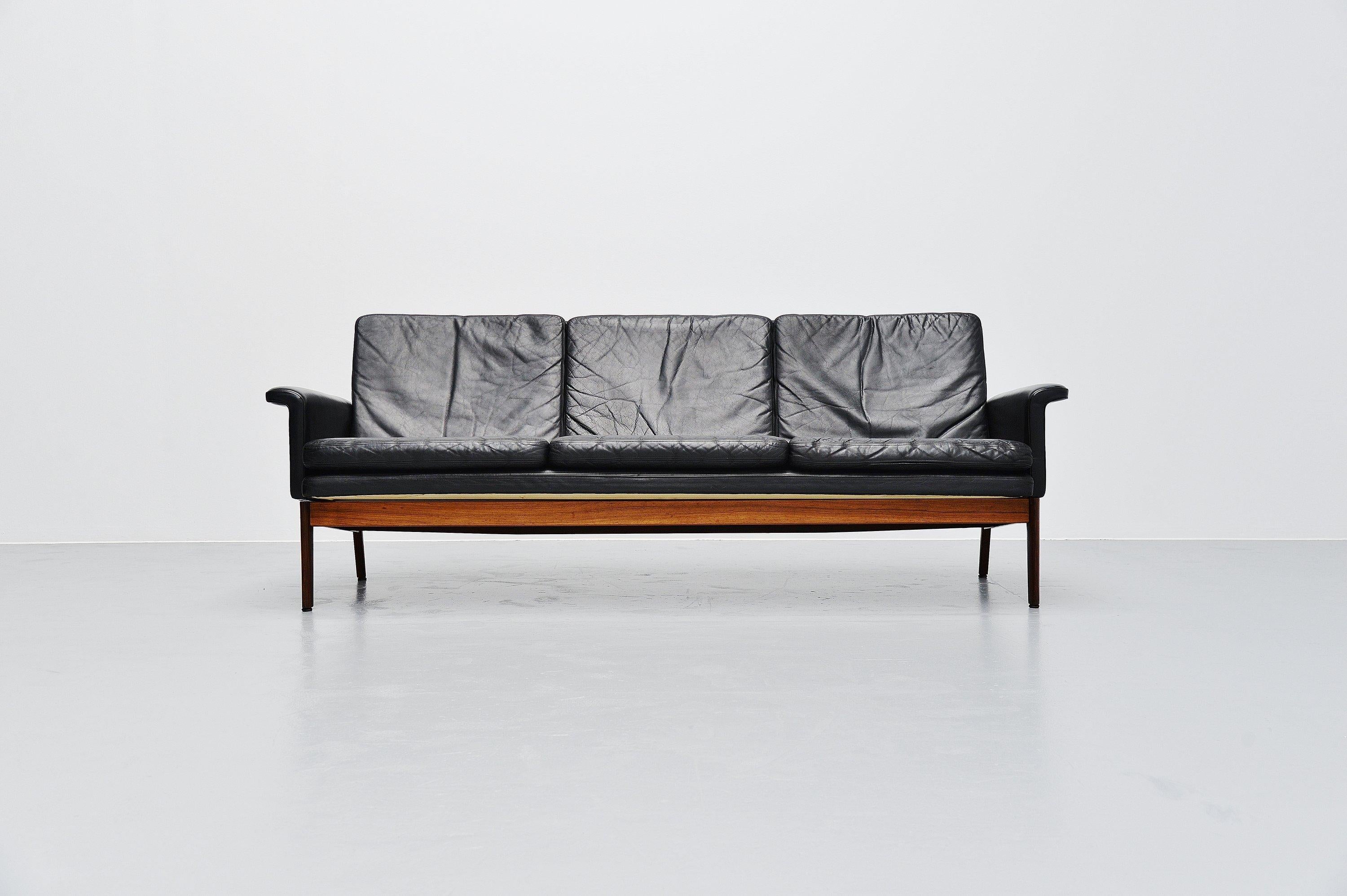 Danish modern so called Jupiter sofa model 218 designed by Finn Juhl and manufactured by France and Son, Denmark 1965. The sofa has a solid rosewood frame and black leather seating. The sofa is in fully original and very good condition. No tears or