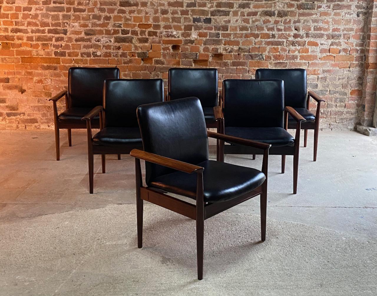 Finn Juhl Model 209 Diplomat chairs in rosewood and leather set of six by Cado, 1965

Midcentury Danish design Finn Juhl Model 209 Diplomat rosewood armchairs manufactured by Cado in Denmark, circa 1965. This model known as the Diplomat is a very