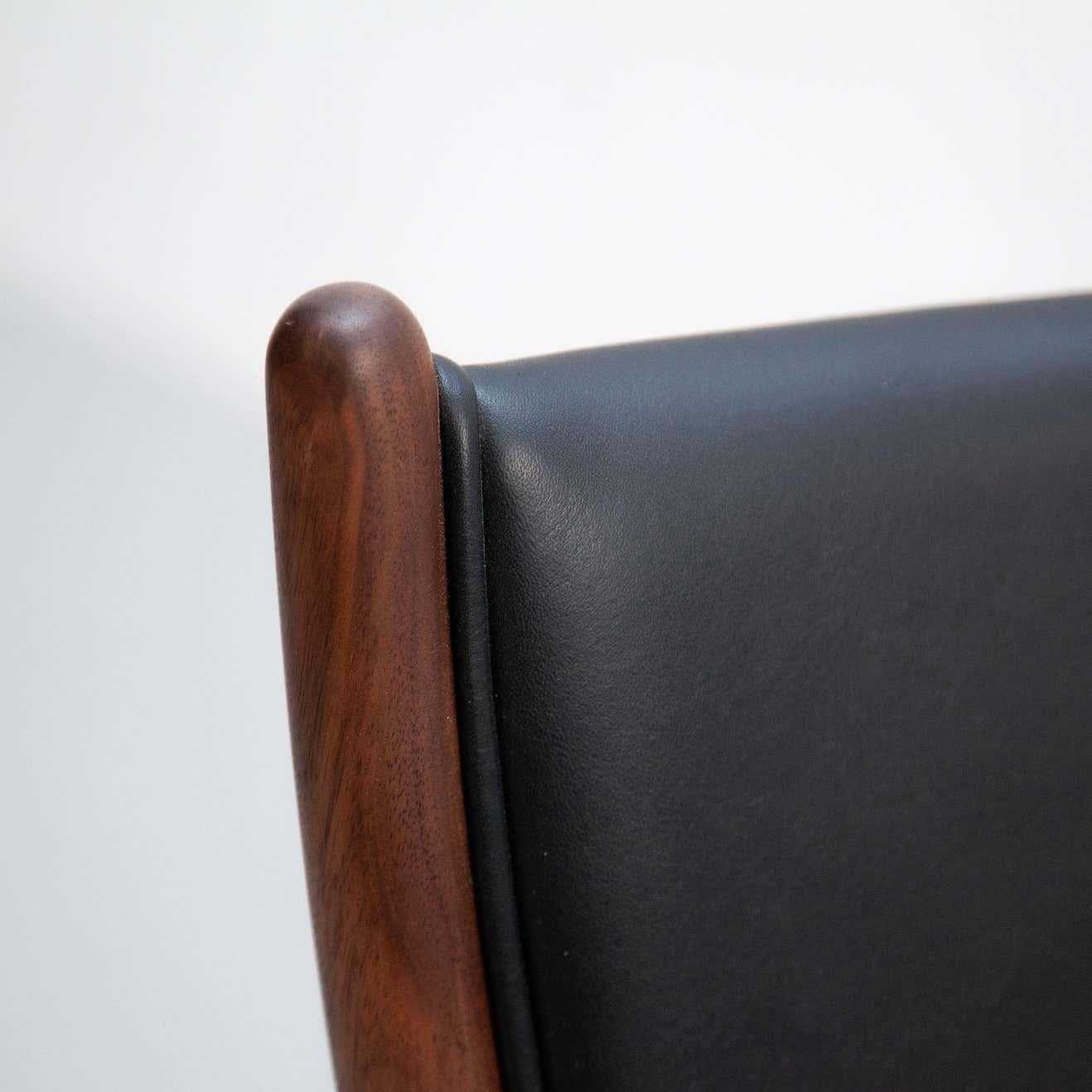 Contemporary Finn Juhl Model 46 Armchair in Walnut and Black Leather by House of Finn Juhl For Sale