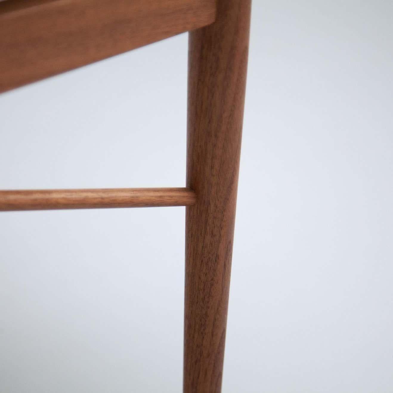 Contemporary Finn Juhl Model 46 Armchair in Walnut and Black Leather by House of Finn Juhl For Sale