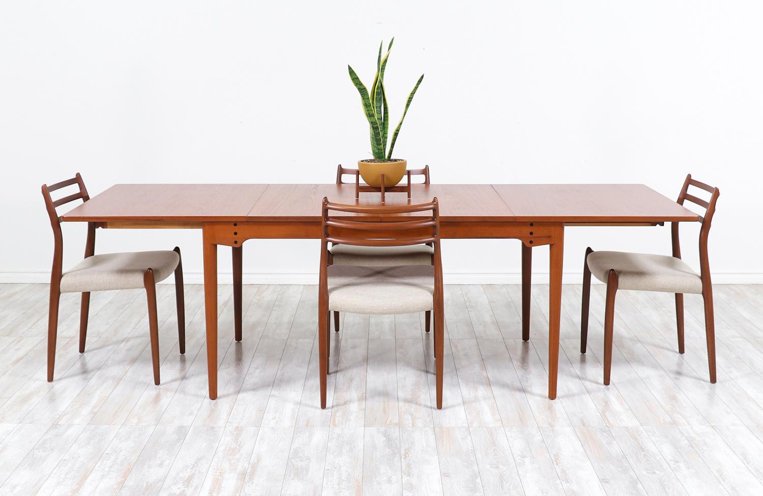 Spectacular Model-BO65 dining table designed by architect Finn Juhl in collaboration with the workshop of Bovirke in Denmark during the 1960s. This unique design features a rectangular expandable top with two removable leaves allowing more table