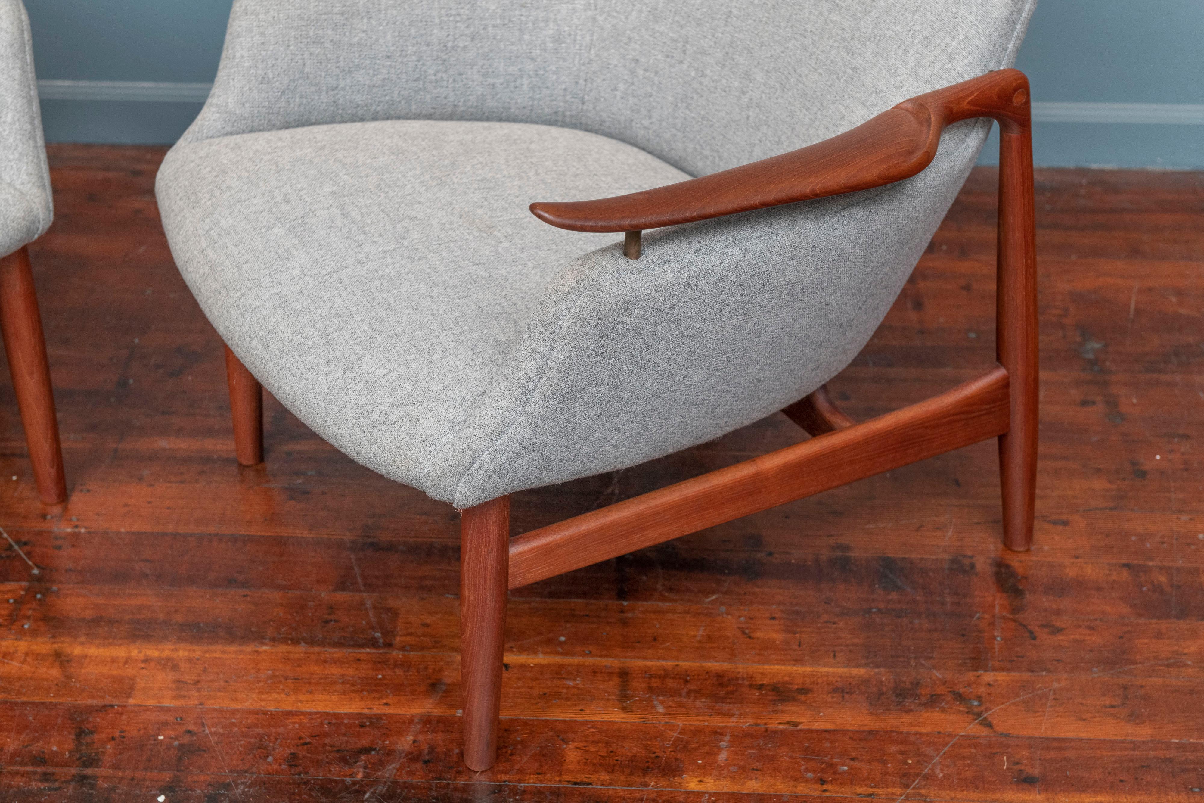 Finn Juhl design NV-53 teak lounge chairs, stamped Niels Vodder, Denmark. Matched original pair of chairs from the original owner newly refinished and upholstered in Danish wool. 
Both chairs are branded with manufacturer's mark, elegant and comfy