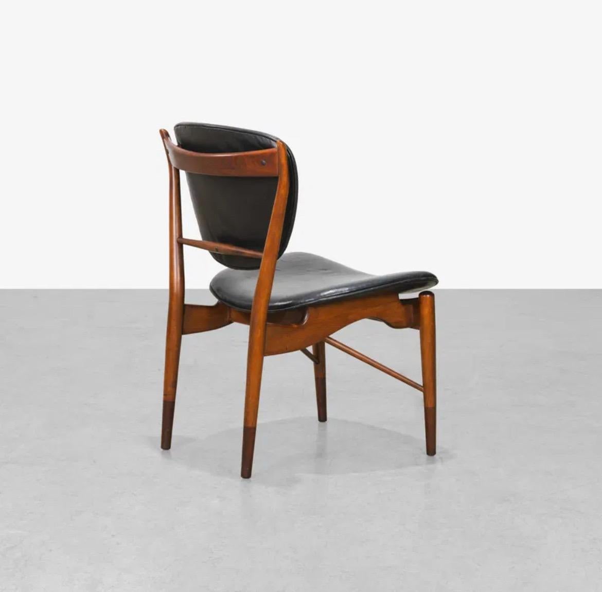 Iconic Model 'NV-51' side chair by Finn Juhl for Niels Vodder, Denmark. Beautiful walnut wood finish and black leather, perfect for a side chair or a desk chair. 