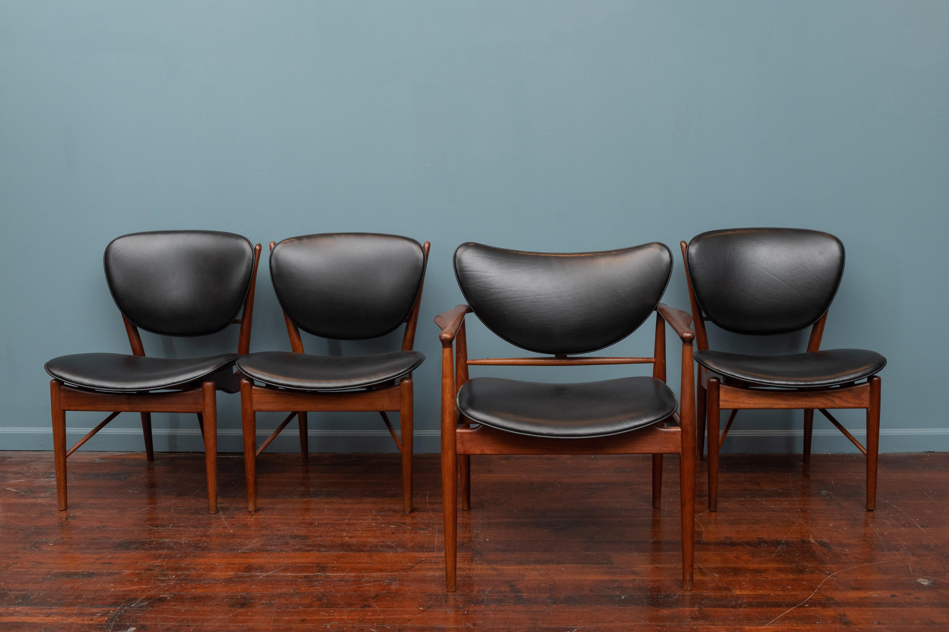 Finn Juhl design NV-51 dining chairs for Baker Furniture Company. Perfectly refinished and newly upholstered in Italian black leather.