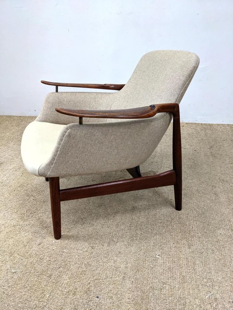 Finn Juhl NV-53, Original Teak Lounge Chair, Niels Vodder, Denmark, 1953. Finn Juhl originally designed the 53-series for master joiner Niels Vodder. It was introduced at the Copenhagen Cabinetmakers' Guild Exhibition later that year. Branded