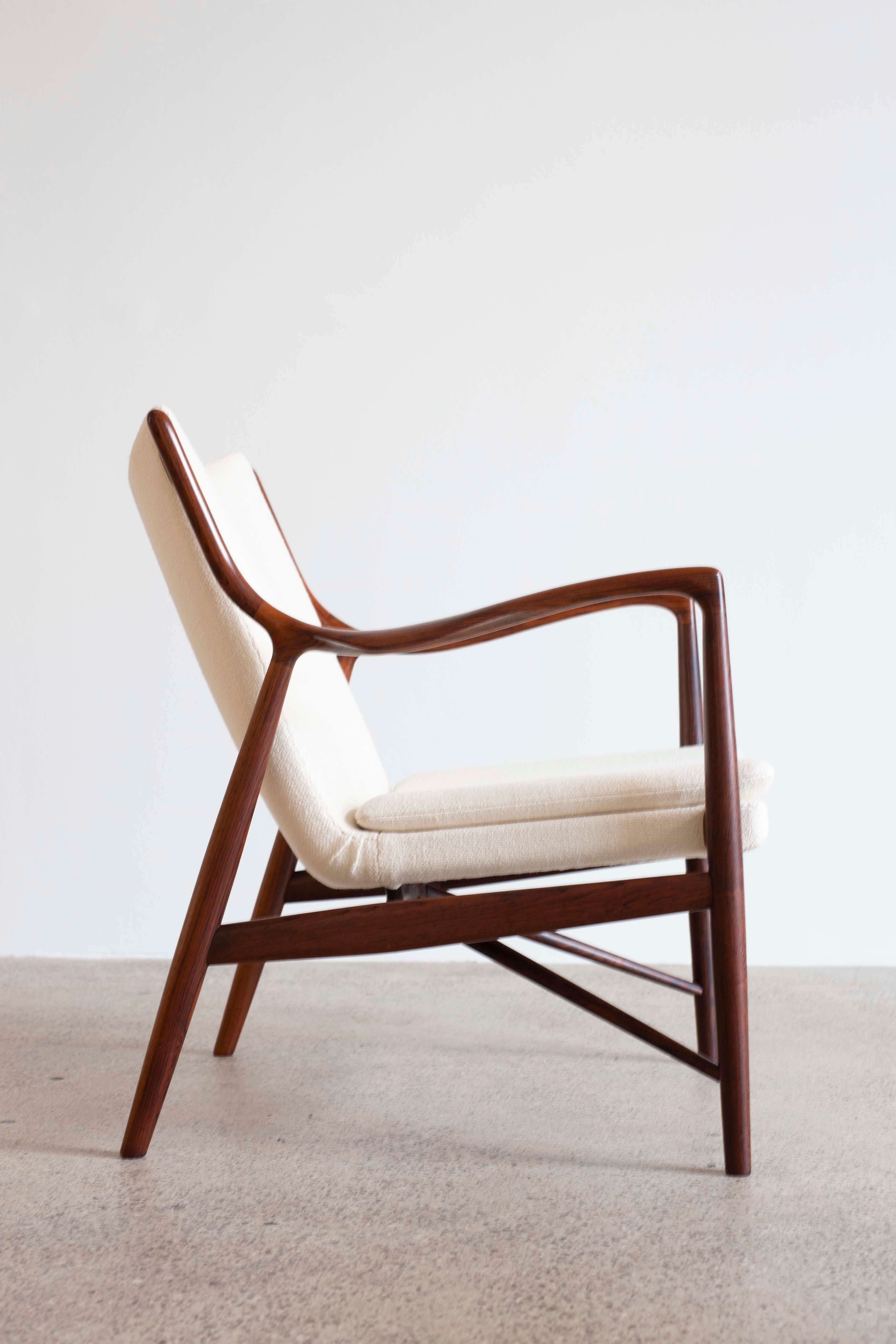 Finn Juhl NV-45 chair with frame of Brazilian rosewood, upholstered with fabric. 
Designed 1945 and made at cabinetmaker Niels Vodder. Stamped by maker. 
Very fine condition. 

A pair of 45 chairs in rosewood available.
 