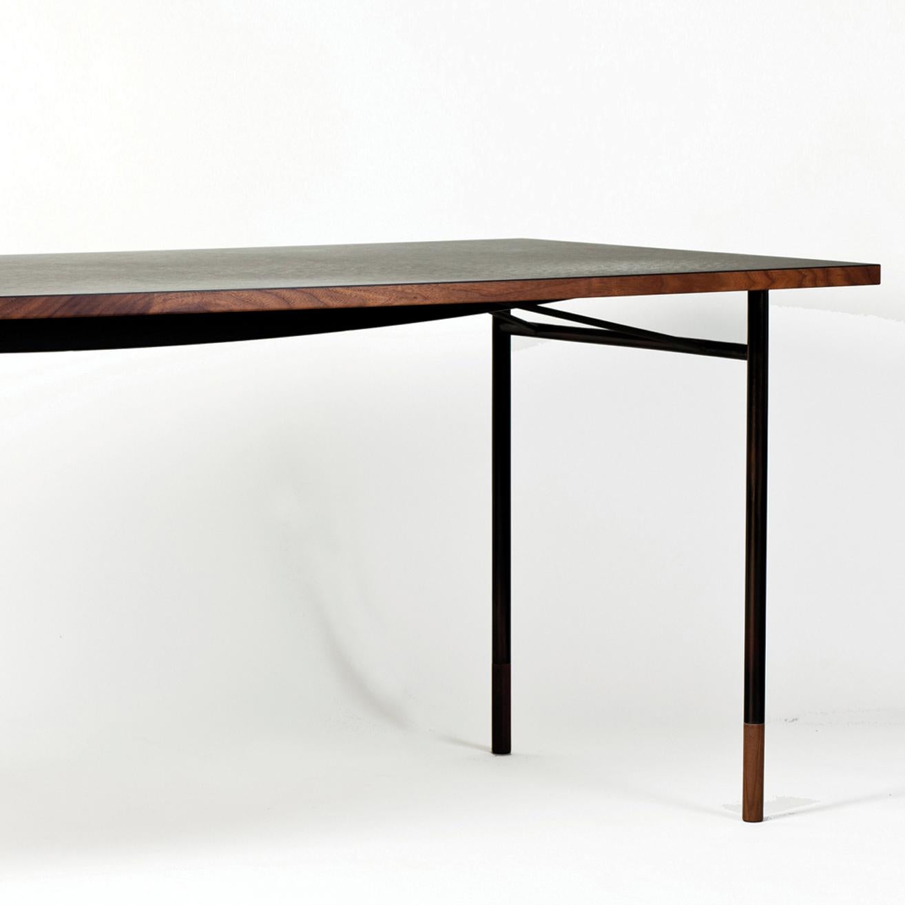 Desk designed by Finn Jhul
Manufactured by One collection Finn Juhl, (Denmark)

When Finn Juhl established his first studio at the exclusive address of 33 Nyhavn in central Copenhagen in 1945, he designed a very simple desk with burnished steel