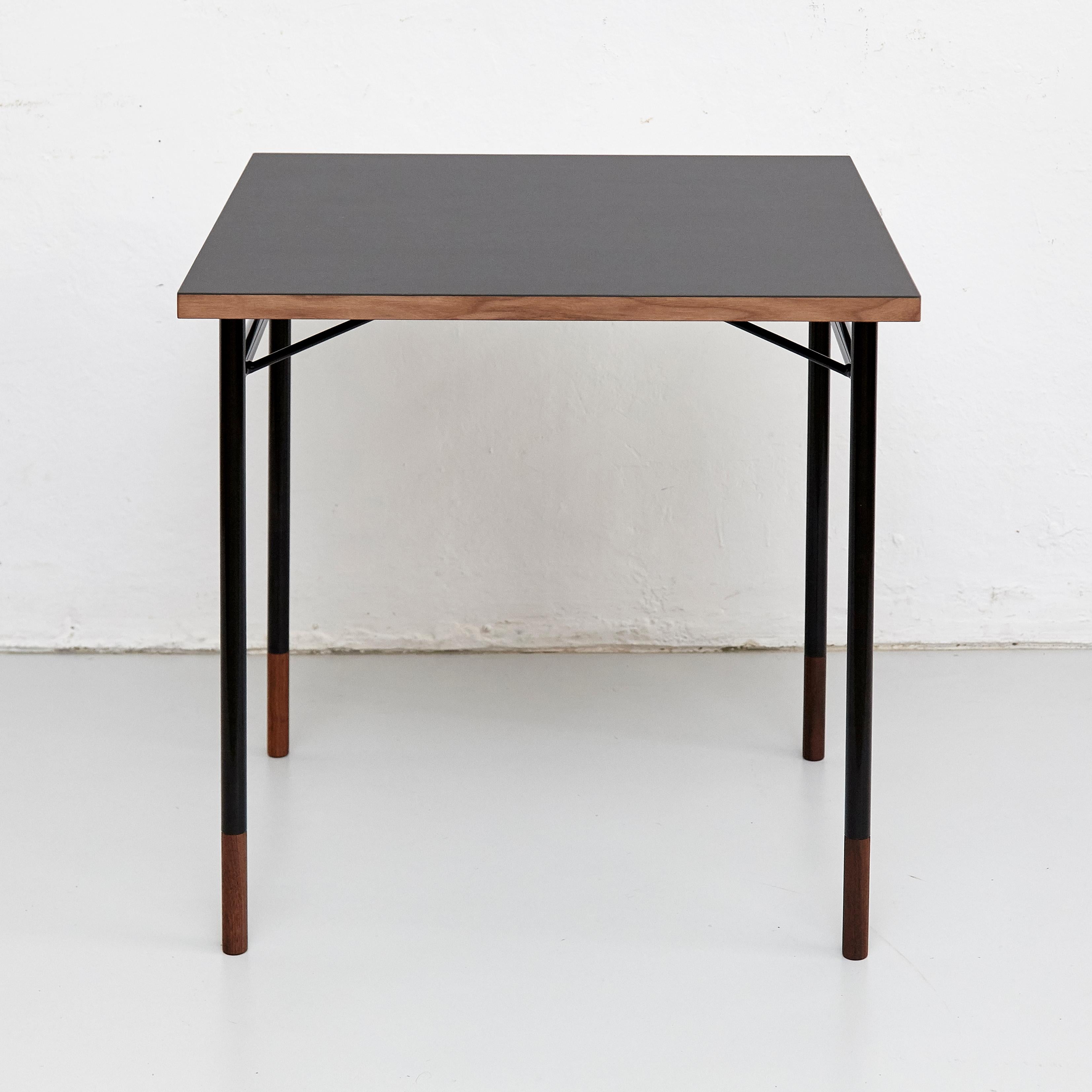 Desk designed by Finn Jhul
Manufactured by one collection Finn Juhl, (Denmark)

When Finn Juhl established his first studio at the exclusive address of 33 Nyhavn in central Copenhagen in 1945, he designed a very simple desk with burnished steel