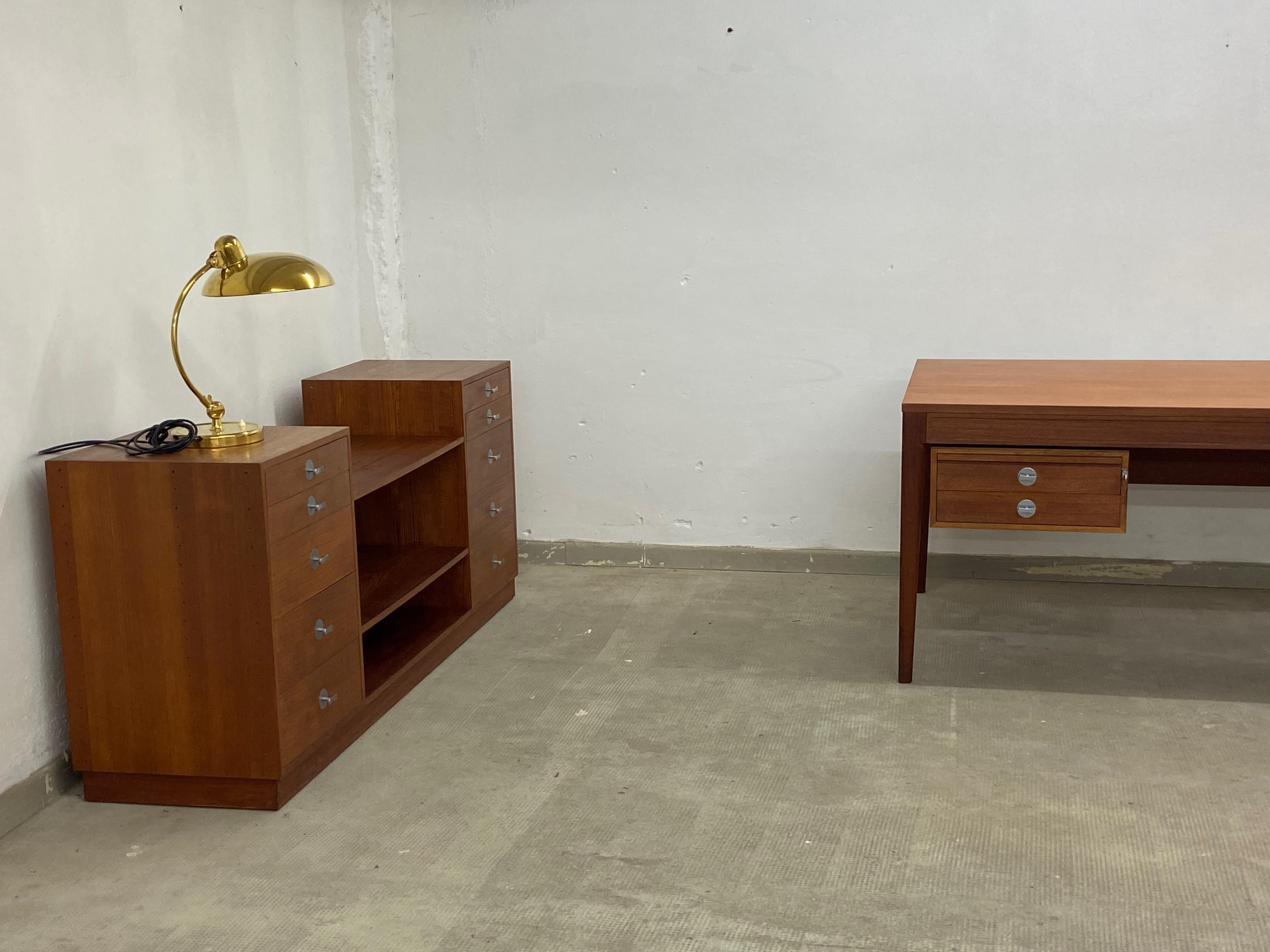 Very nice Office Set by Finn Juhl for France & Son Denmark. One large writing desk and one Sideboard. The backside from the Board is also in Teak veneer so it can stay in the middle of the room. Desk and Board in very nice vintage condition with