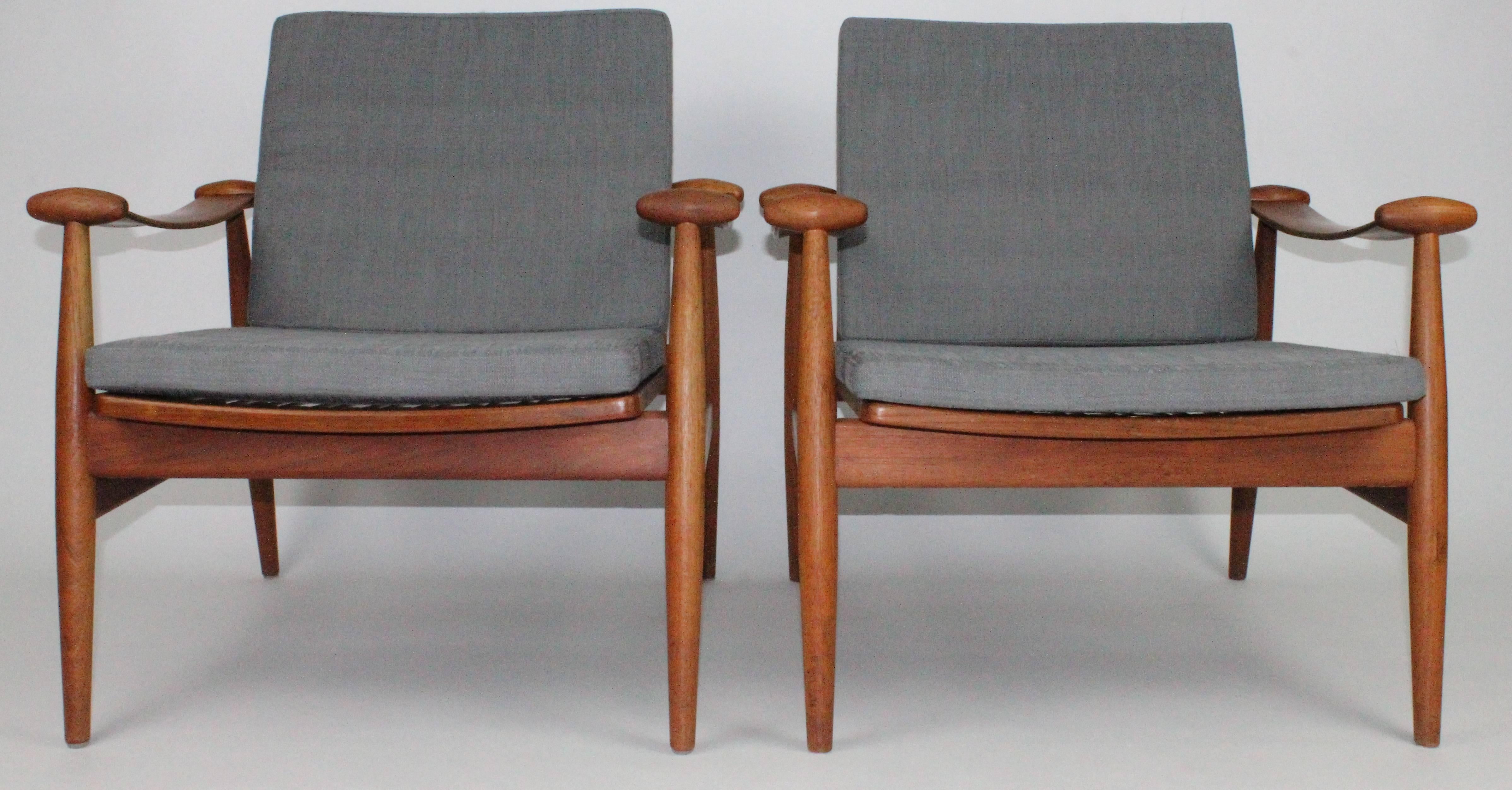 Wonderful pair of teak chairs by Danish designer Finn Juhl. These chairs were made by the original maker France & Daverkosen. The firm changed their name in 1957 to France & Son. These are early examples. The real name for these chairs are 