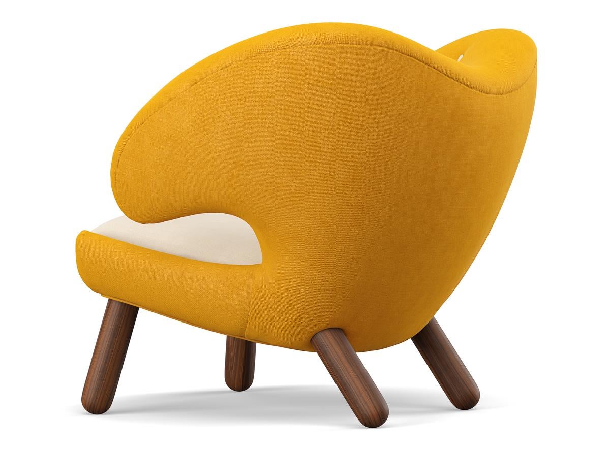 Pelican chair designed by Finn Juhl in 1940.
Manufactured by House of Finn Juhl in Denmark.

Pelican chair was probably the one furthest ahead of its time. When it was presented at the Copenhagen Cabinetmakers’ Guild Exhibition in 1940, it stood