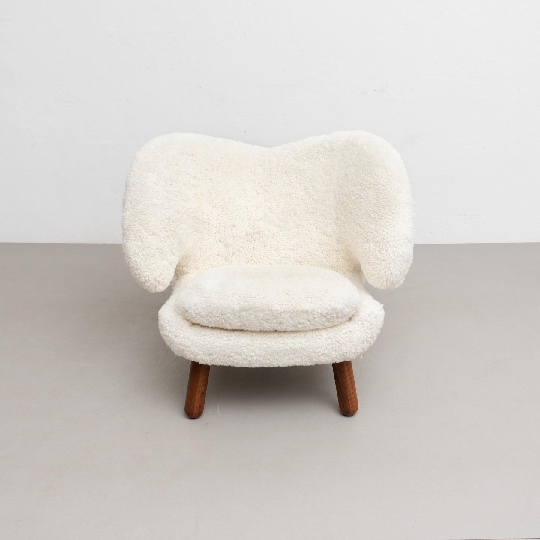 Danish Finn Juhl Pelican Chair Upholstered in Gotland Sheepskin For Sale