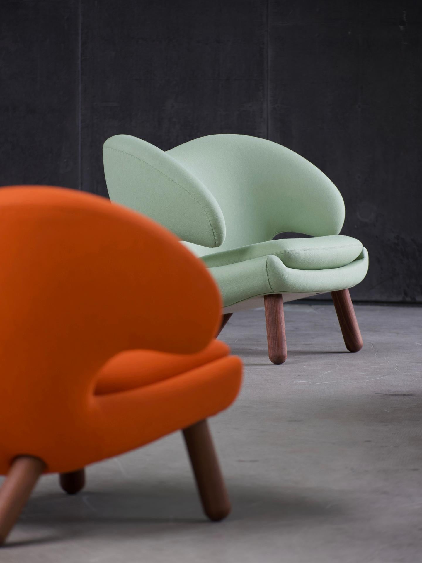 Contemporary Finn Juhl Pelican Chair Upholstered in Orange Fabric
