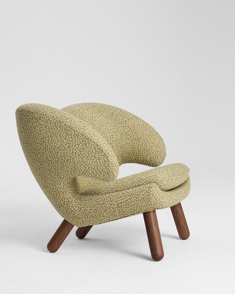 Pelican chair designed by Finn Juhl in 1940.
Manufactured by House of Finn Juhl in Denmark.

Pelican Chair was probably the one furthest ahead of its time. When it was presented at the Copenhagen Cabinetmakers’ Guild Exhibition in 1940, it stood