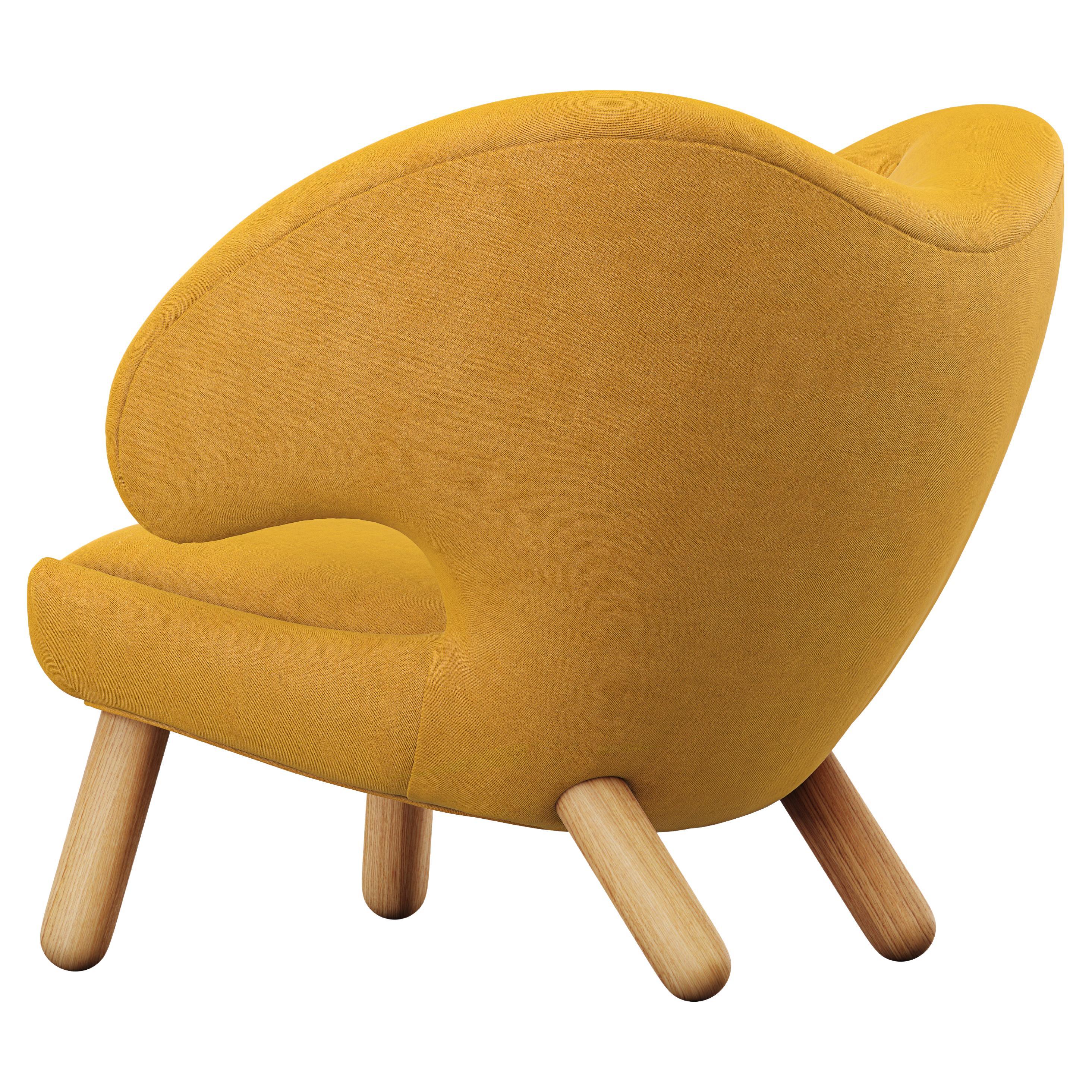 Chaise Pélican Finn Juhl tapissée de bois et de tissu