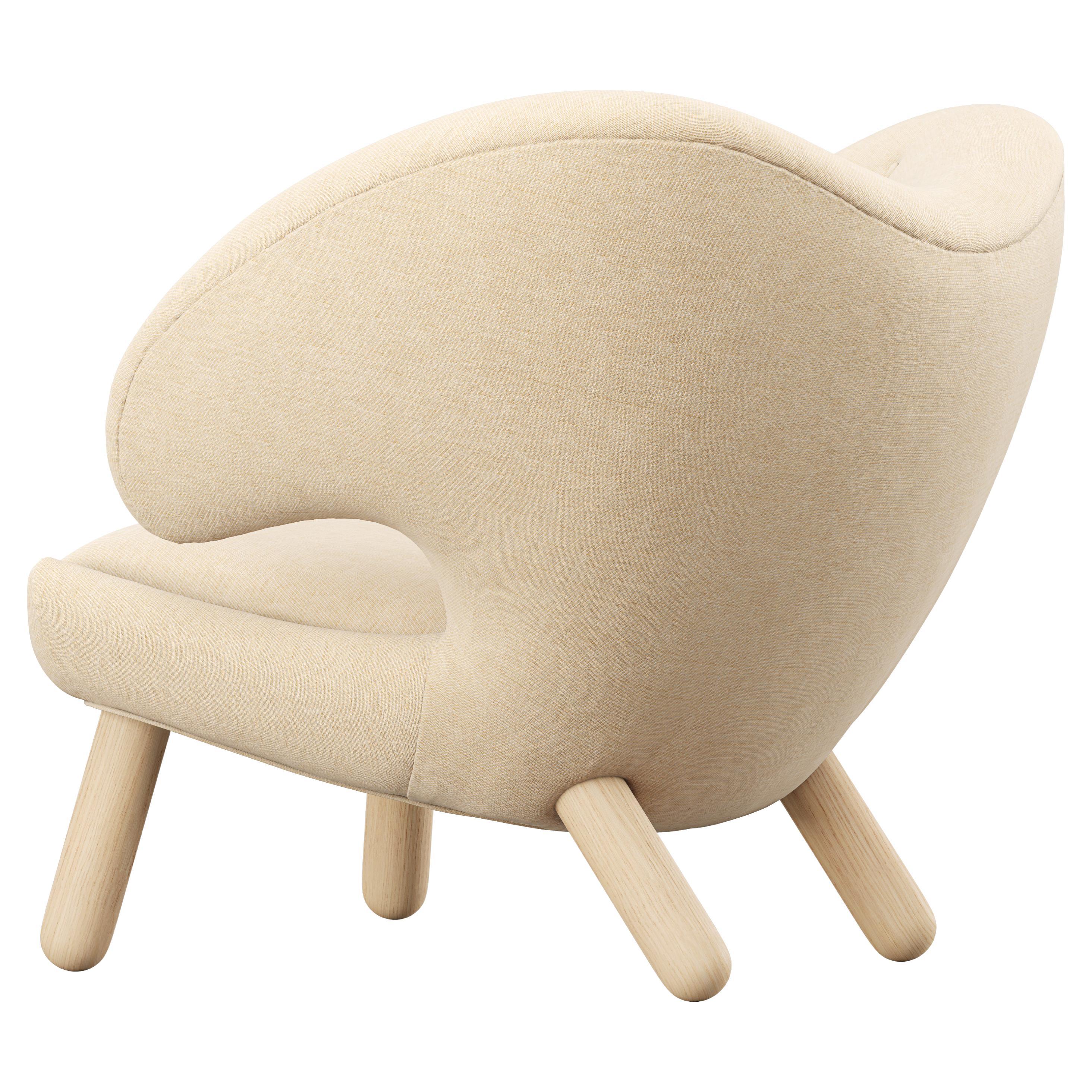 Chaise Pélican Finn Juhl tapissée de bois et de tissu