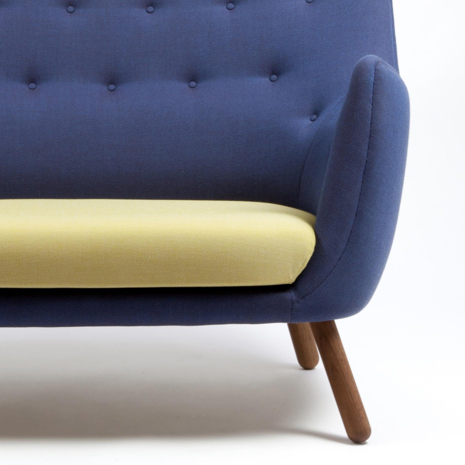 Sofa designed by Finn Juhl in 1946, relaunched in 2008.
Manufactured by House of Finn Juhl in Denmark.

This small two-seater sofa first saw the light of day at the Copenhagen Cabinetmakers’ Guild Exhibition in 1941. It should be seen as a