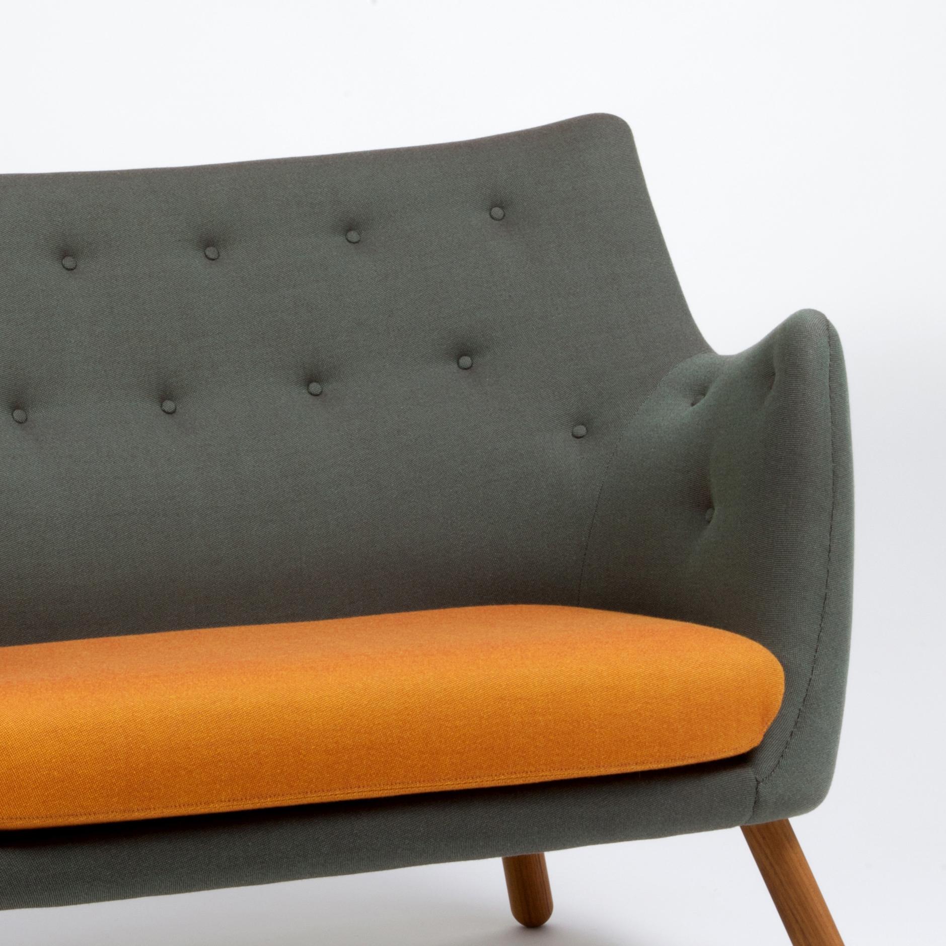 Sofa designed by Finn Juhl in 1946, relaunched in 2008.
Manufactured by House of Finn Juhl in Denmark.

This small two-seater sofa first saw the light of day at the Copenhagen Cabinetmakers’ Guild Exhibition in 1941. It should be seen as a