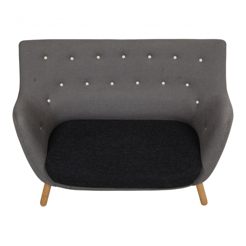 Finn Juhl 2. seater Poet sofa in grey and black Hallingdal fabric. The sofa is from around the 90's but has been reupholstered around 3 years ago, so the sofa appears with minimal signs of use.