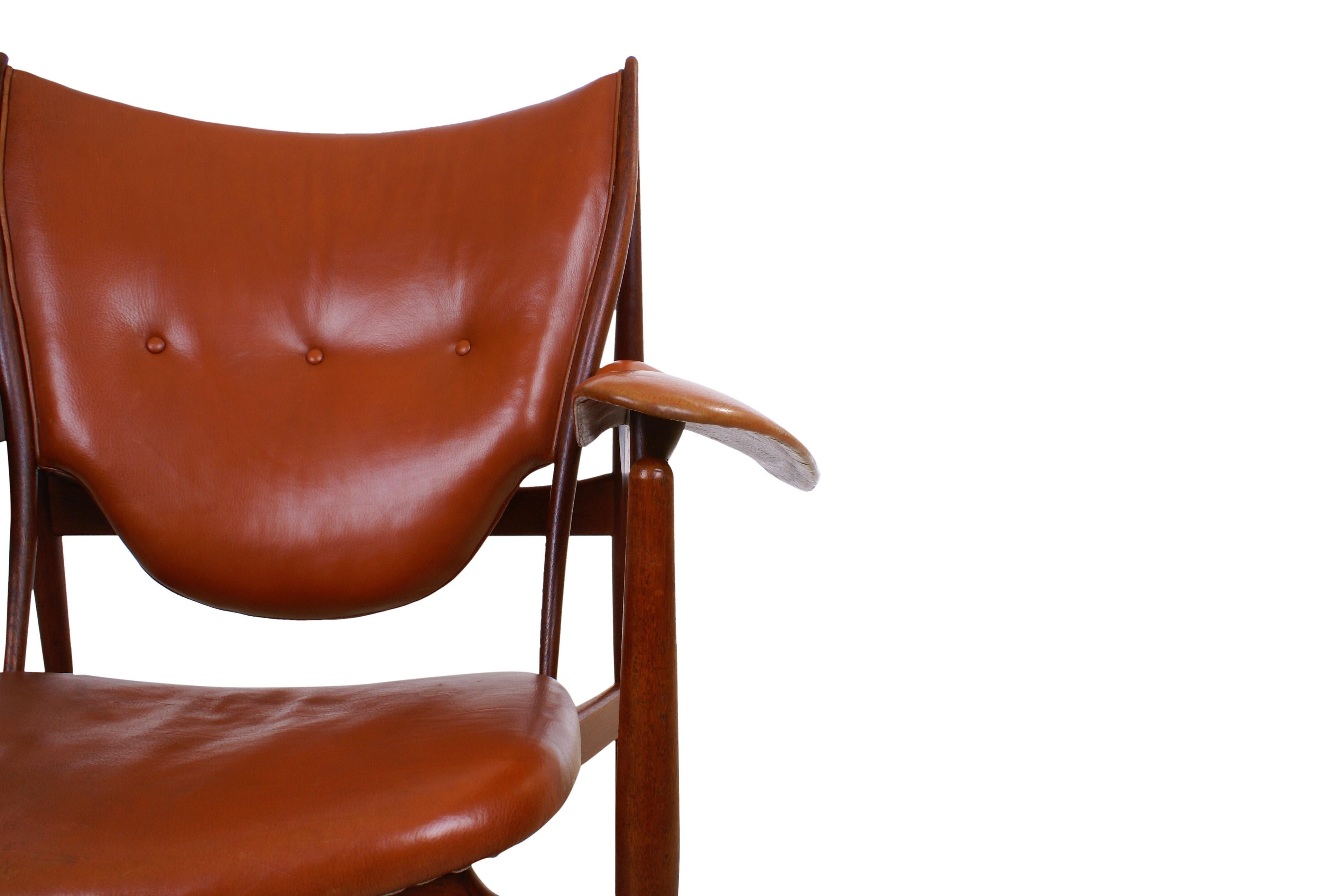 Finn Juhl, rare chieftain chair in teak and original patinated red leather for master cabinetmaker Niels Vodder, Copenhagen, Denmark. Designed 1949. This chair made in the 1950s.

Finn Juhl has told the following story of how the chair got its