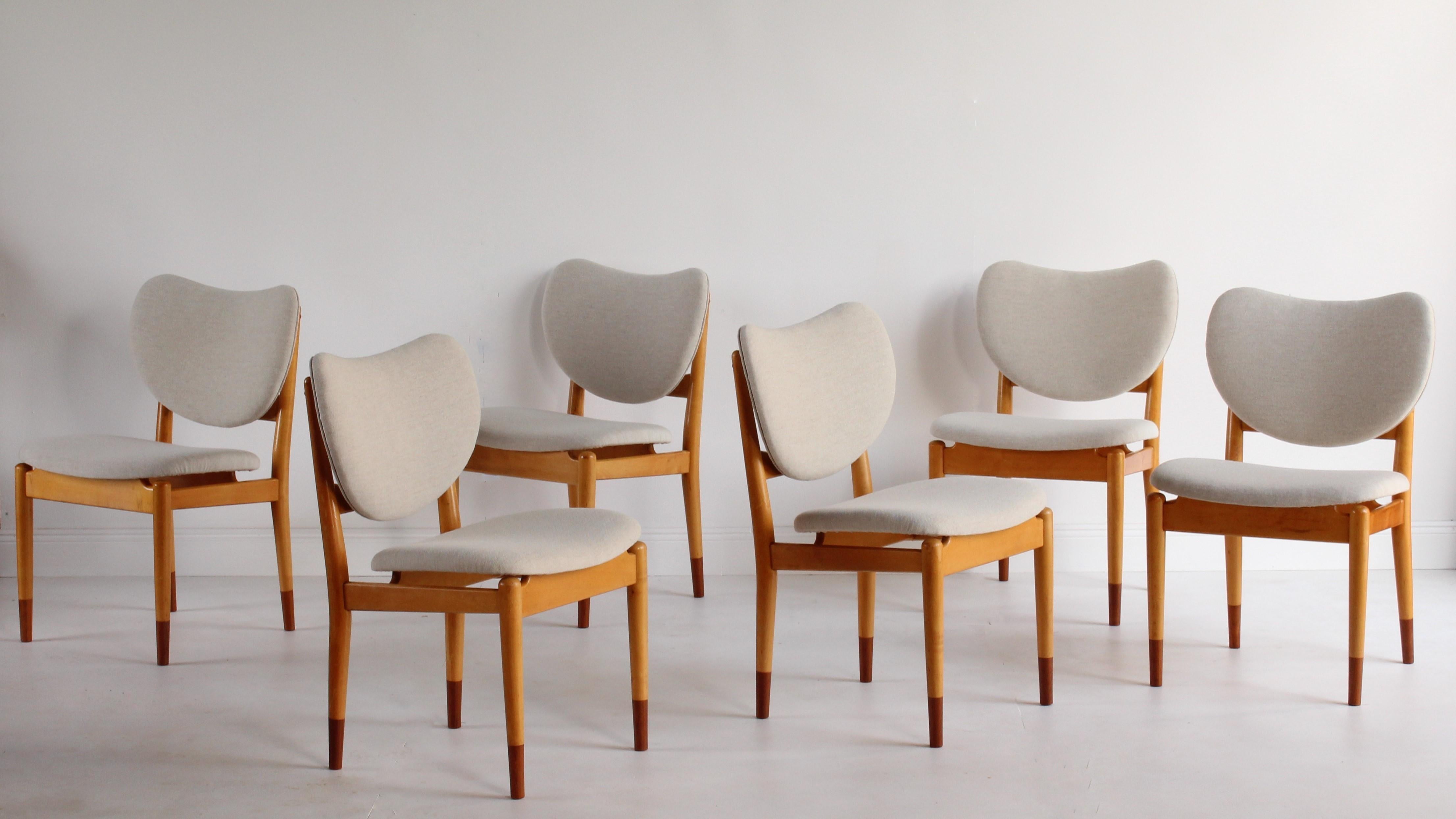 A rare dining group of six dining / side chairs designed by Finn Juhl and produced by Søren Willadsen Møbelfabrik. Executed in maple frames with teak feet, and upholstered in a light beige, high-end, Danish fabric. 

This rare design by Finn Juhl