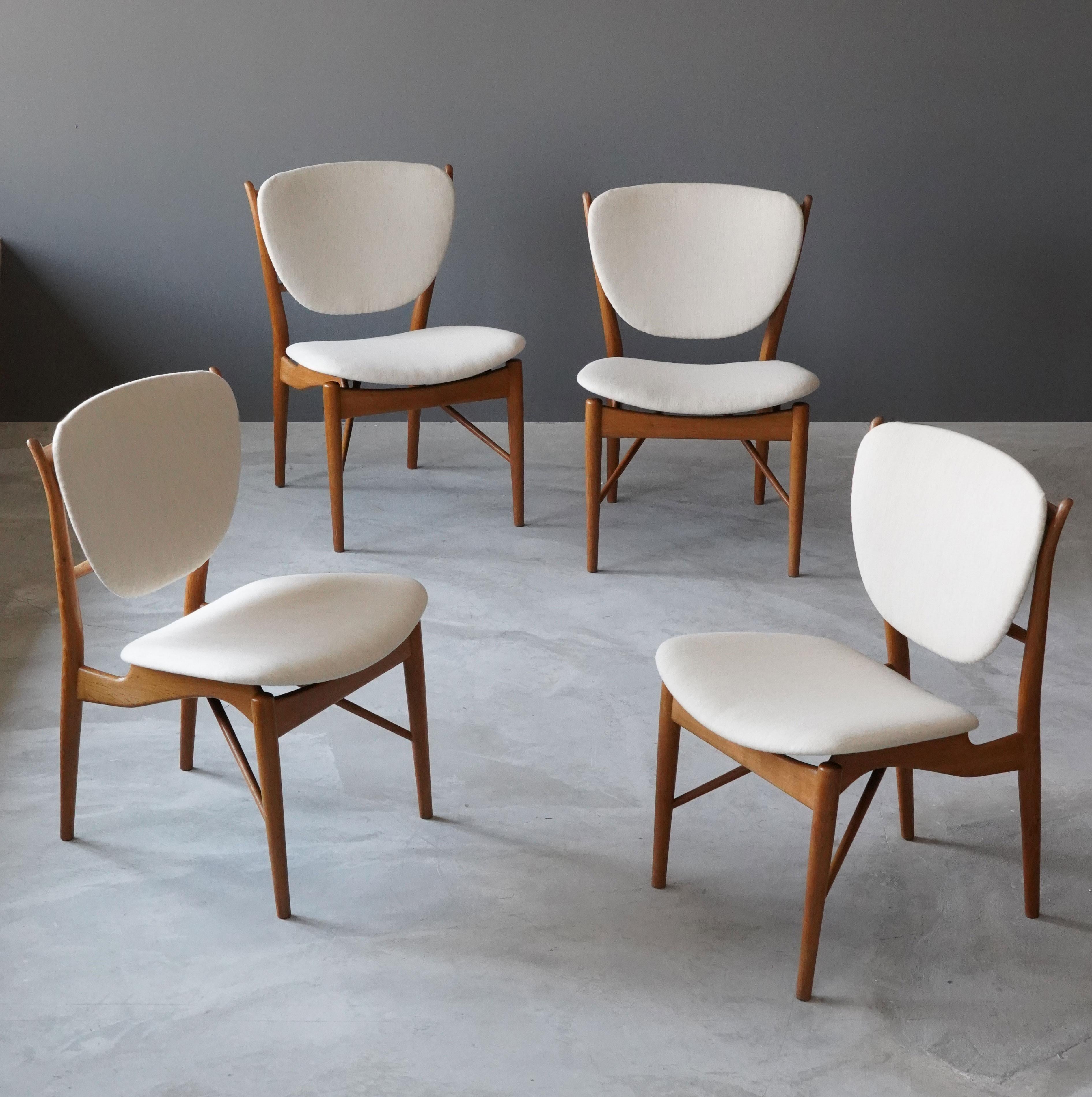 A set of 4 rare dining or side chairs. Designed by Finn Juhl, executed by cabinet maker Niels Vodder, Copenhagen, Denmark, 1950s. In finely and organically sculpted oak. Reupholstered in brand new Scandinavian high-end fabric.

Other designers of