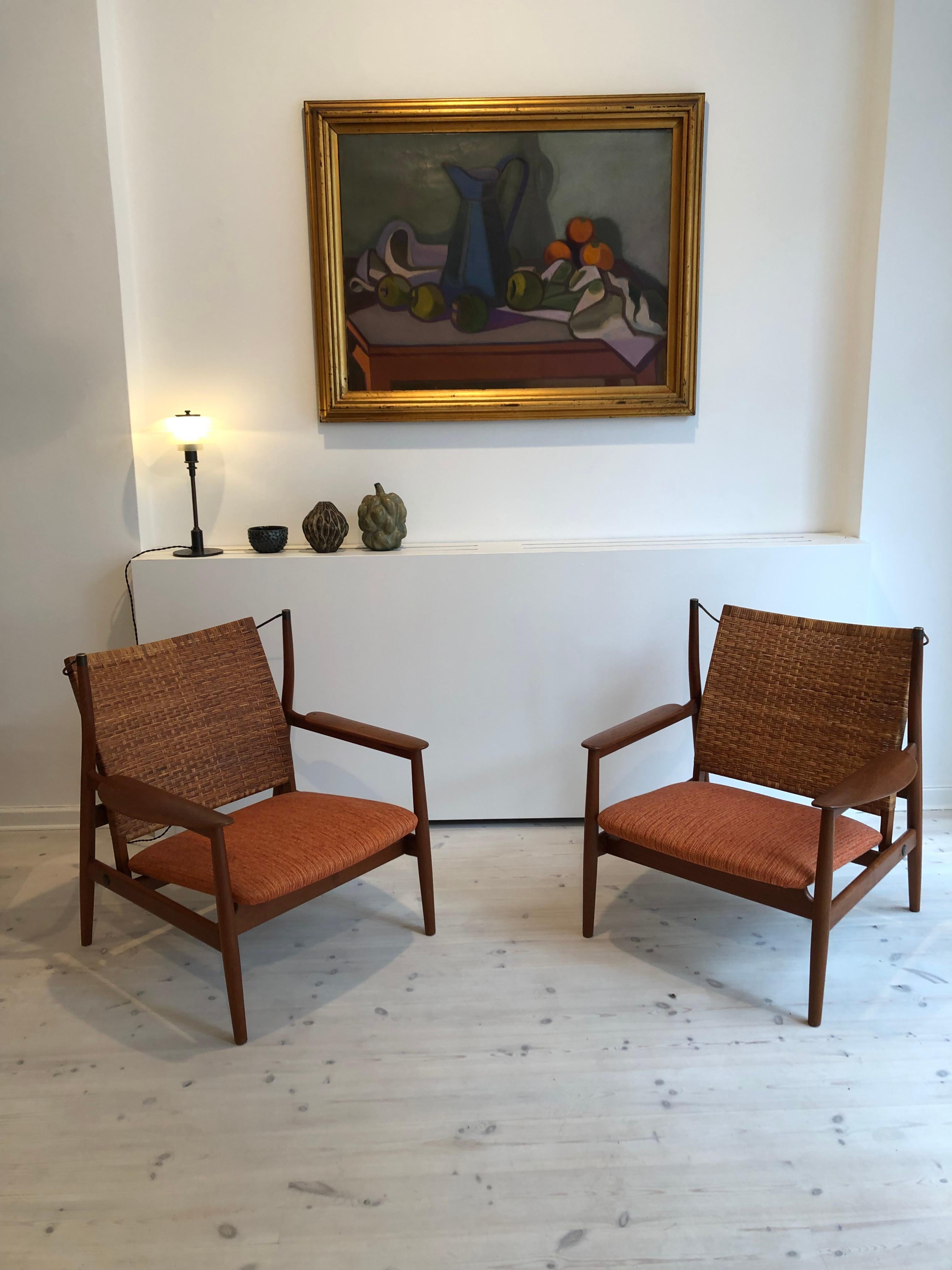 Mid-20th Century Finn Juhl Rare Pair of NV55 Armchairs in Teak and Cane for Niels Vodder, 1955