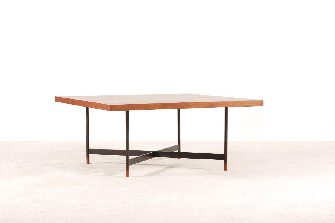 Rare teak coffee model table FJ-57 designed by Finn Juhl in 1957.
Top made from highly figured teak wood supported by a black lacquered metal X-base frame on turned teak wood feet.
Manufactured by Niels Vodder cabinet maker in the 1950s.

Good